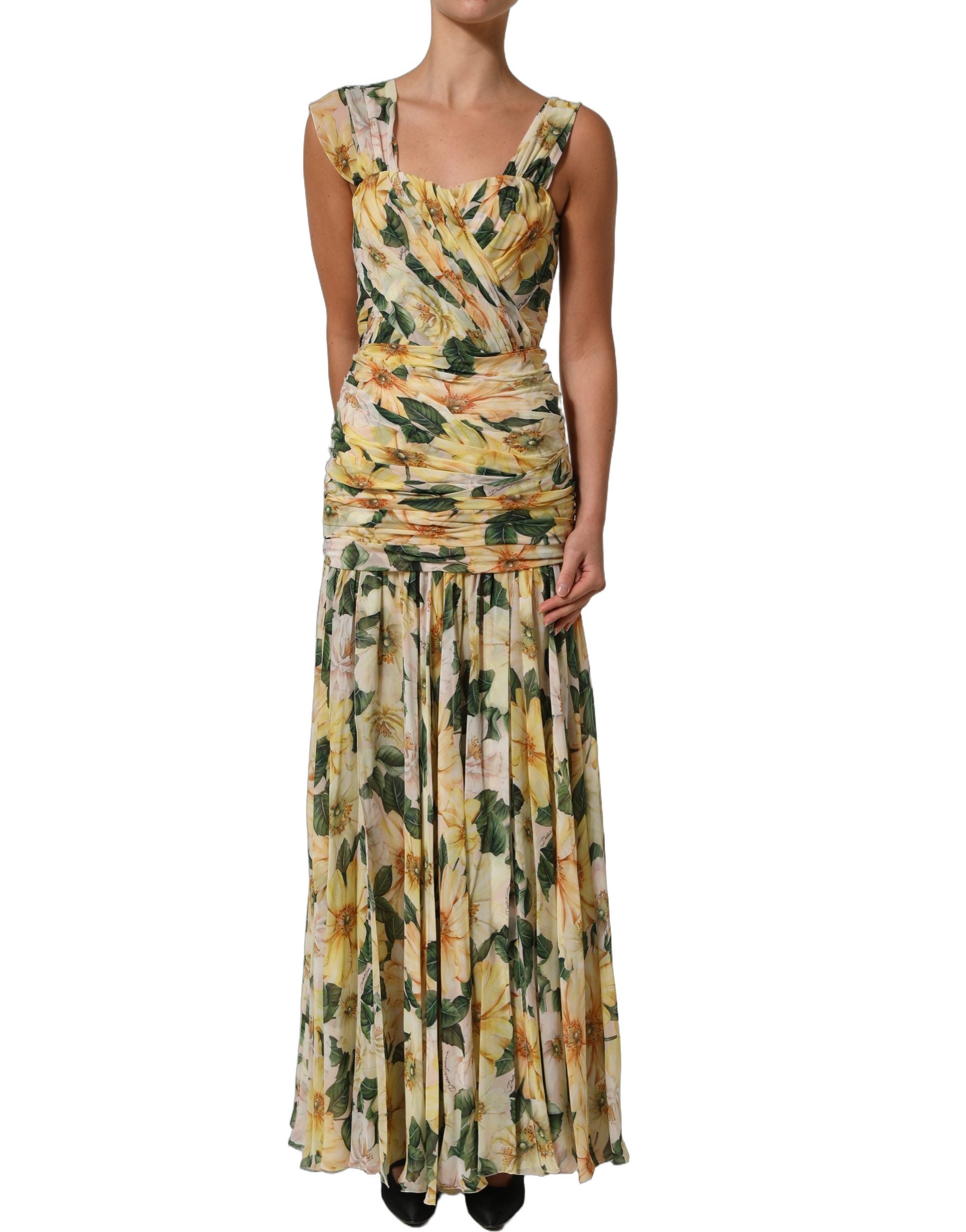 Indulge in the exquisite Dolce & Gabbana Yellow Floral Print Silk Pleated Maxi Dress, a masterpiece of Italian craftsmanship that embodies timeless elegance and luxurious allure.