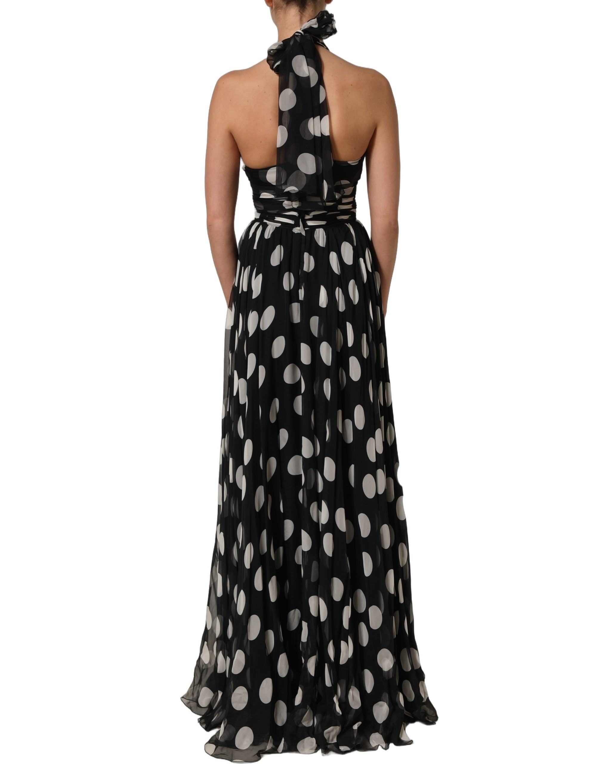 Indulge in the exquisite Dolce & Gabbana Black White Polka Dot Pleated Maxi Dress, a silk masterpiece that embodies timeless elegance and Italian craftsmanship for unforgettable moments.