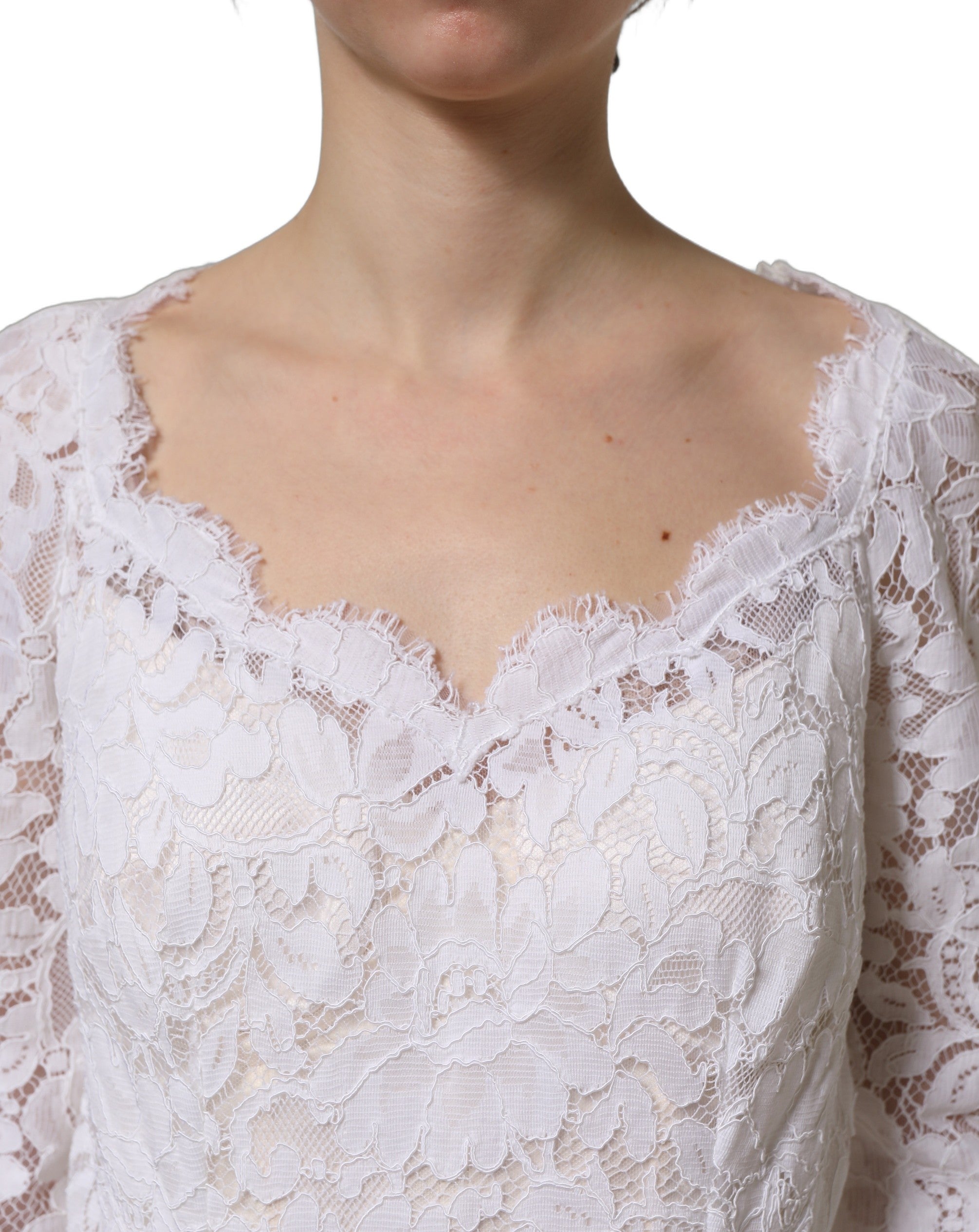 Experience the exquisite allure of the Dolce & Gabbana White Floral Lace Mermaid Long Gown, a timeless masterpiece of luxury and unparalleled craftsmanship.