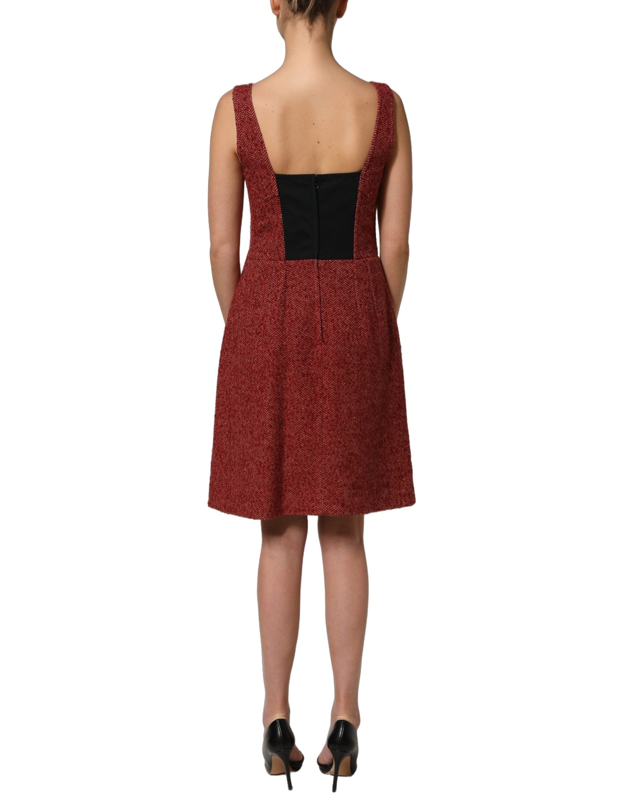 Elevate your wardrobe with the Dolce & Gabbana Multicolor Tweed Belted Babydoll Mini Dress, a masterpiece of Italian craftsmanship that embodies timeless elegance and sophistication.