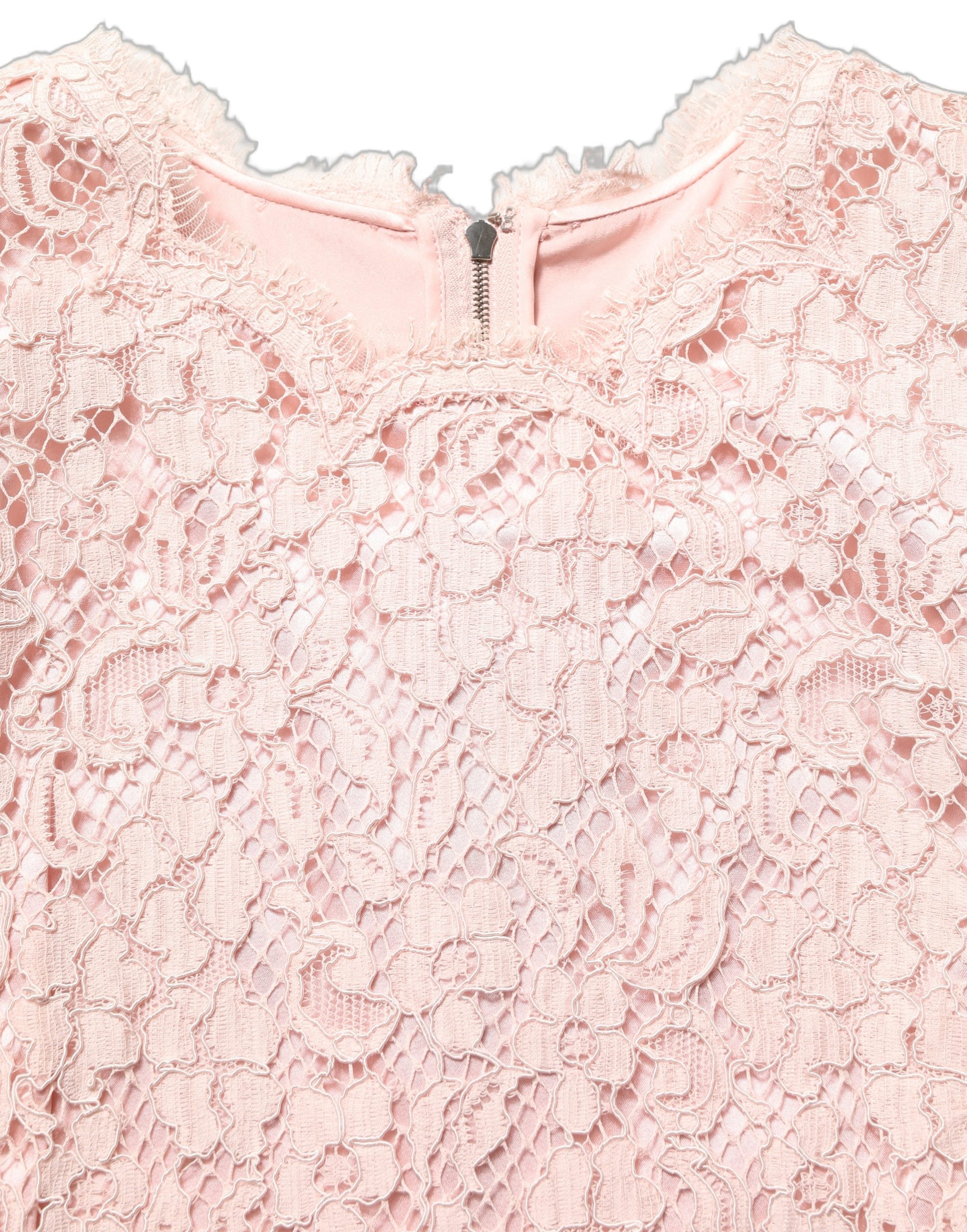Indulge in the exquisite Dolce & Gabbana Pink Cotton Floral Lace Mini Dress, a masterpiece of craftsmanship that embodies timeless elegance and sophisticated allure.