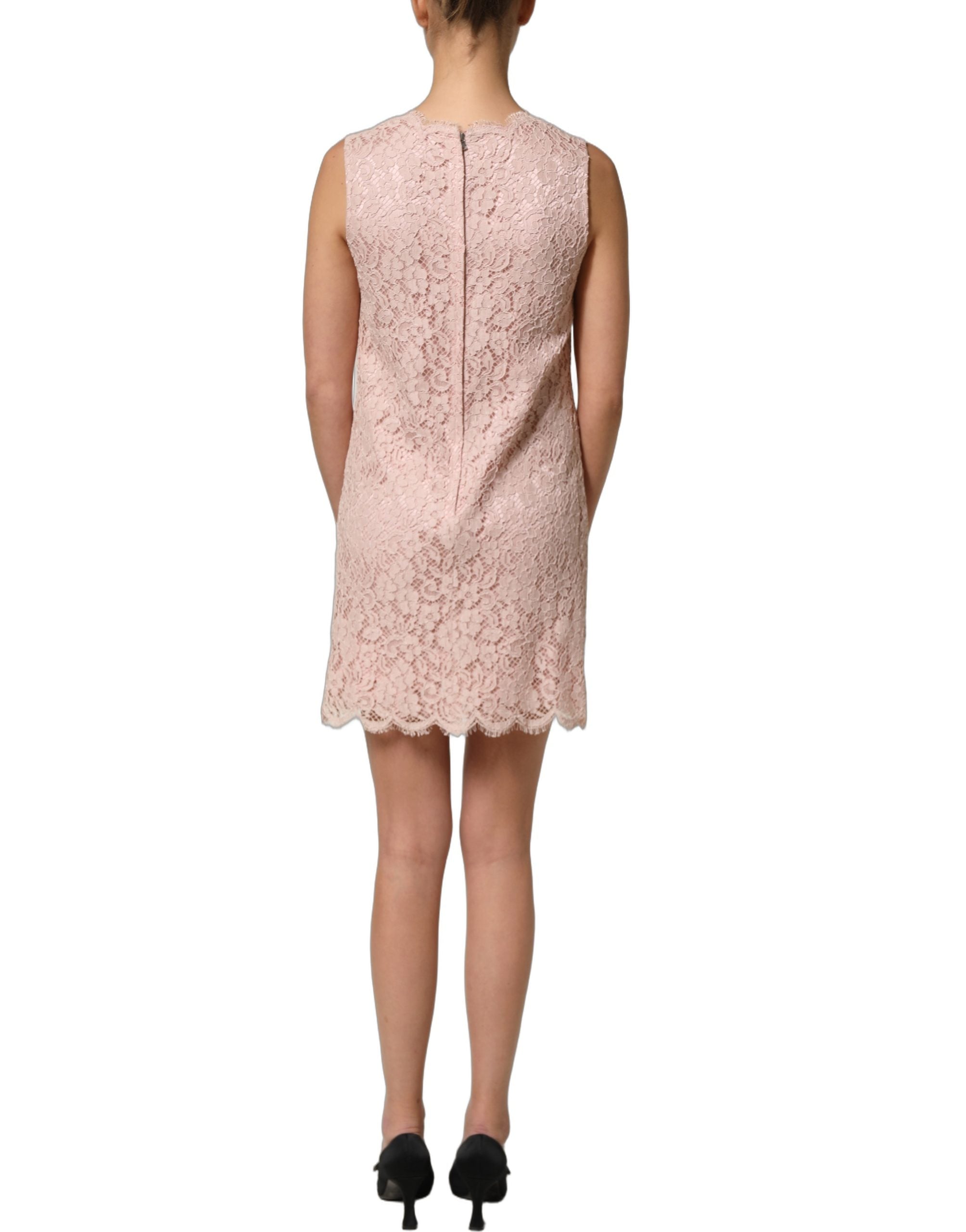 Embrace elegance with the Dolce & Gabbana Pink Cotton Floral Lace Mini Dress, a masterpiece of exquisite craftsmanship and timeless allure, perfect for sophisticated occasions.