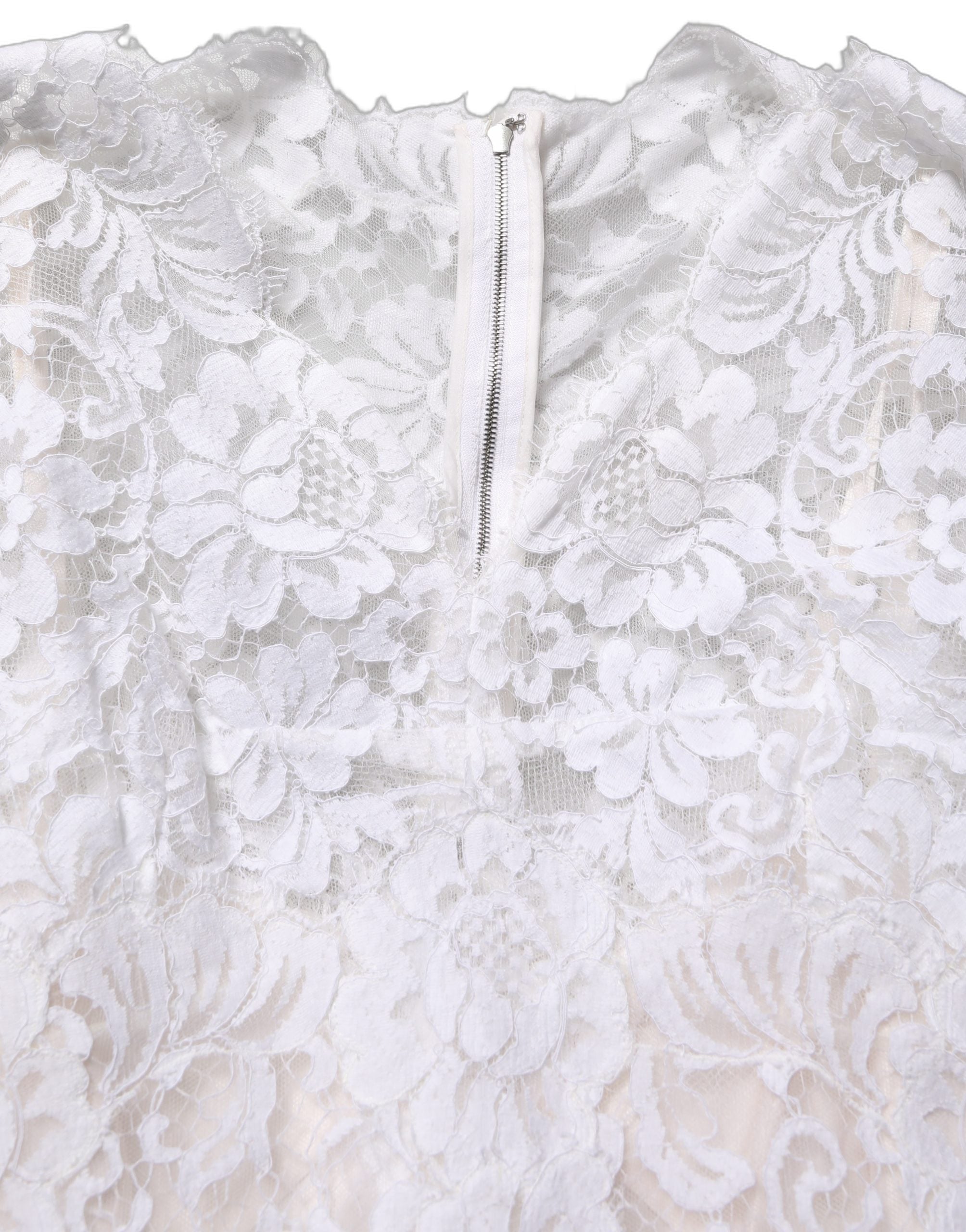 Discover the Dolce & Gabbana White Cotton Floral Lace Long Gown, a masterpiece of Italian craftsmanship that embodies timeless elegance and allure.