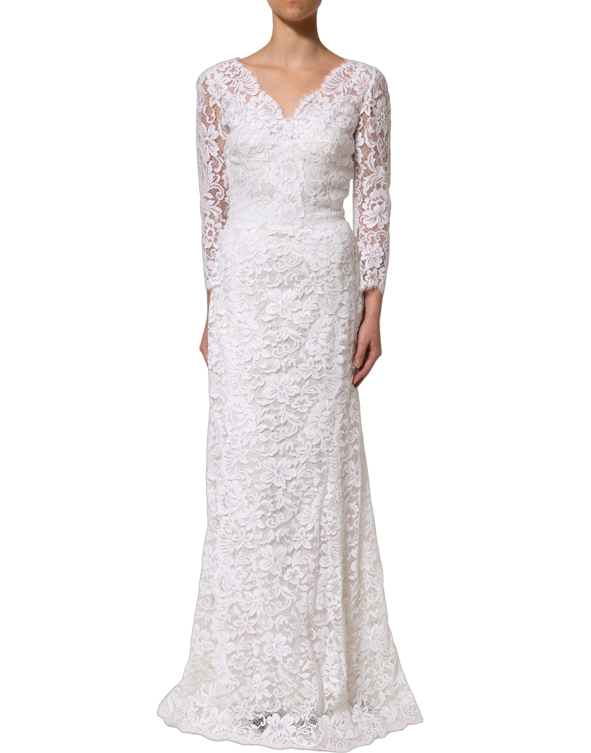 Discover the exquisite Dolce & Gabbana White Cotton Floral Lace Long Gown, a masterpiece of Italian craftsmanship that embodies timeless elegance and sophistication.