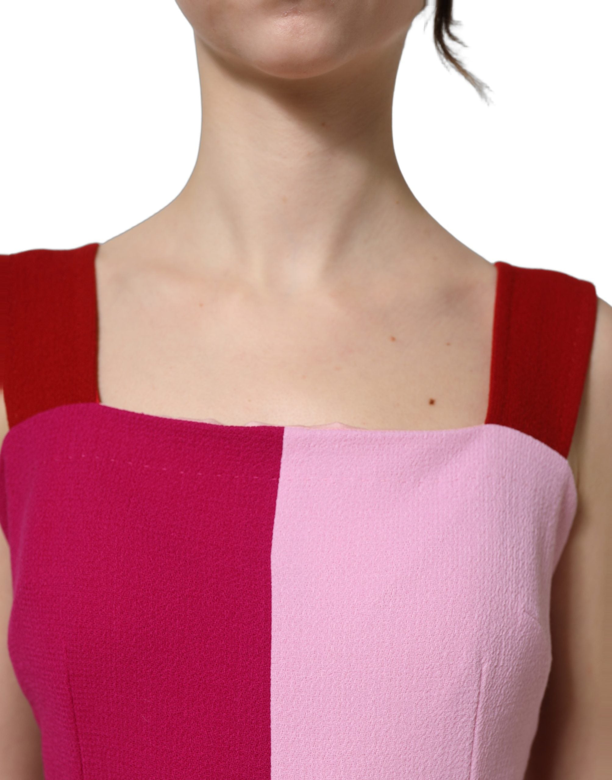 Indulge in the elegance of the Dolce & Gabbana Two Tone Pink Wool Sleeveless Midi Dress, a masterpiece of Italian craftsmanship that redefines luxury and sophistication.