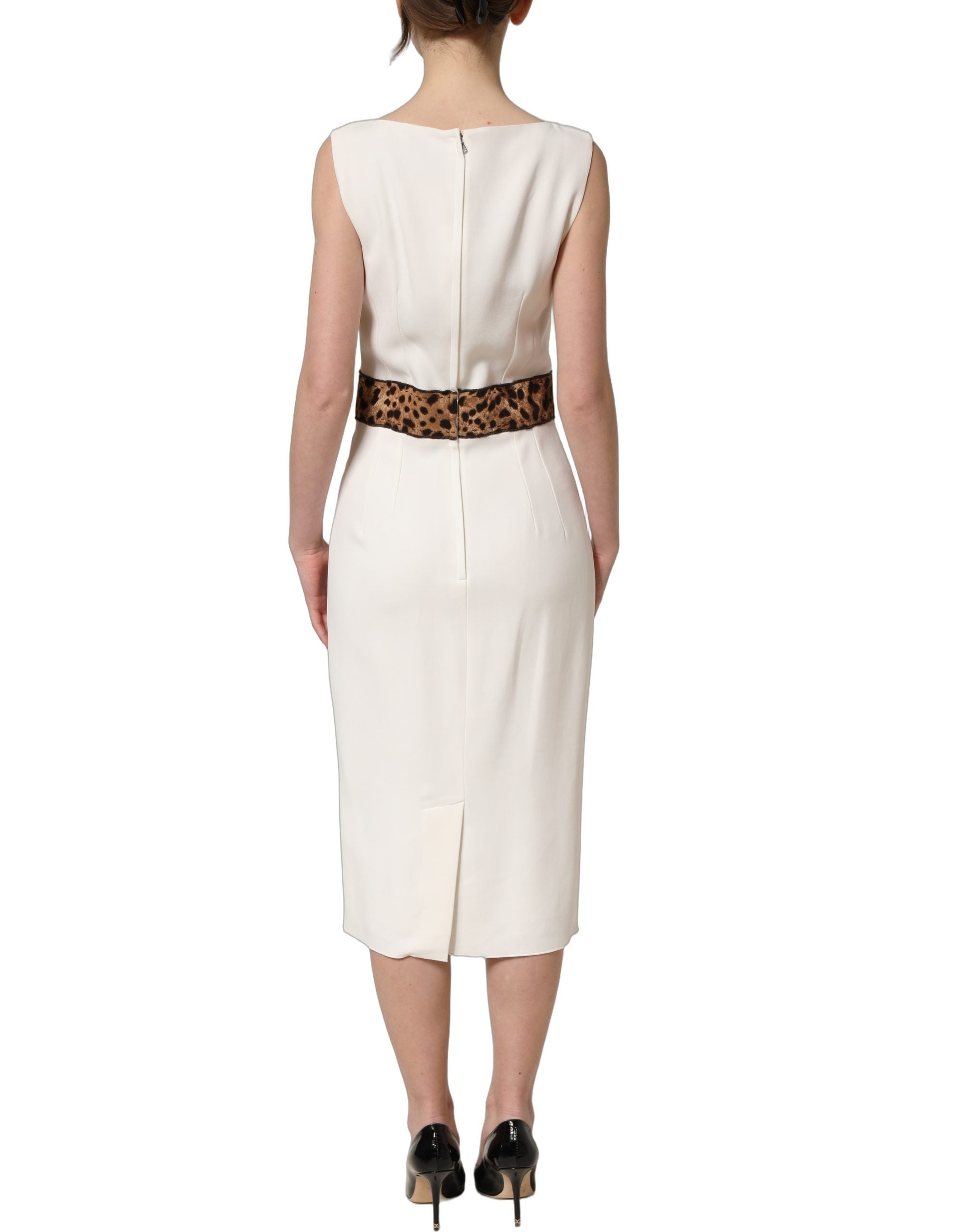 Indulge in the exquisite Dolce & Gabbana White Leopard Sleeveless Sheath Midi Dress, where luxurious materials and Italian craftsmanship meet timeless elegance for unforgettable moments.