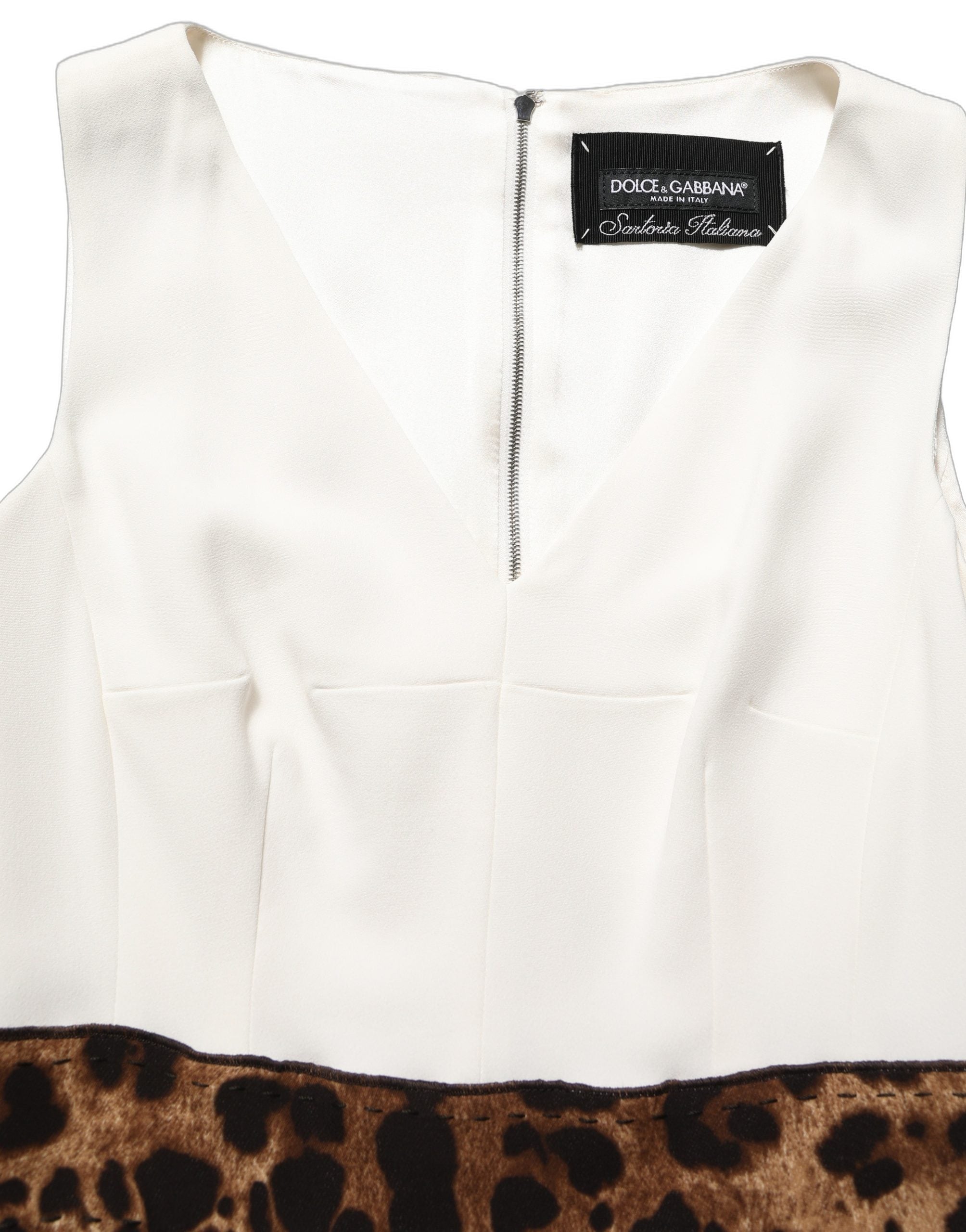 Elevate your elegance with the Dolce & Gabbana White Leopard Sleeveless Sheath Midi Dress, a luxurious blend of exquisite materials and Italian craftsmanship, perfect for unforgettable moments.
