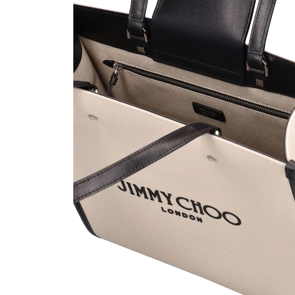 Discover the Jimmy Choo Beige Canvas Tote Bag, a symbol of artisanal luxury and sophistication, crafted in Italy for those who appreciate timeless elegance.