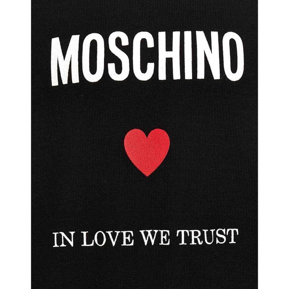 Indulge in the sophistication of the Moschino Couture Black Cotton Sweatshirt, crafted from luxurious cotton, embodying elegance and effortless style for the discerning individual.