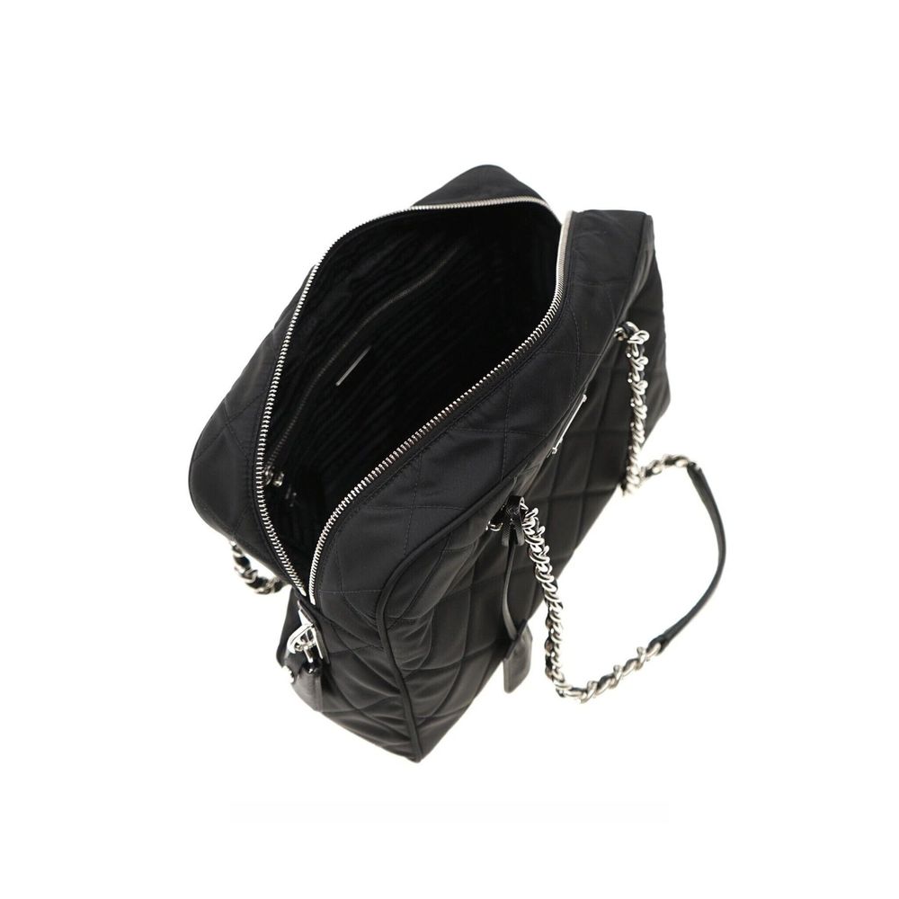 Indulge in the artisanal luxury of the Prada Black Nylon Shoulder Bag, a timeless accessory crafted from 100% nylon, perfect for elevating any ensemble with sophistication.