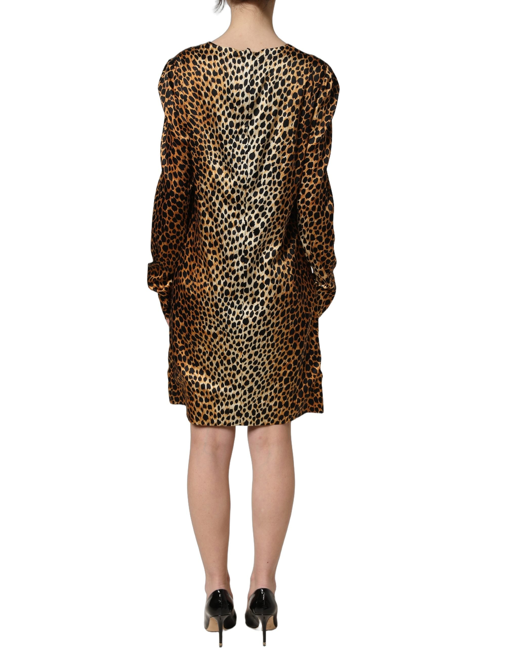 Indulge in the exquisite Dolce & Gabbana Brown Ocelot Print Long Sleeve Mini Dress, where luxurious silk meets impeccable craftsmanship for a timeless statement.