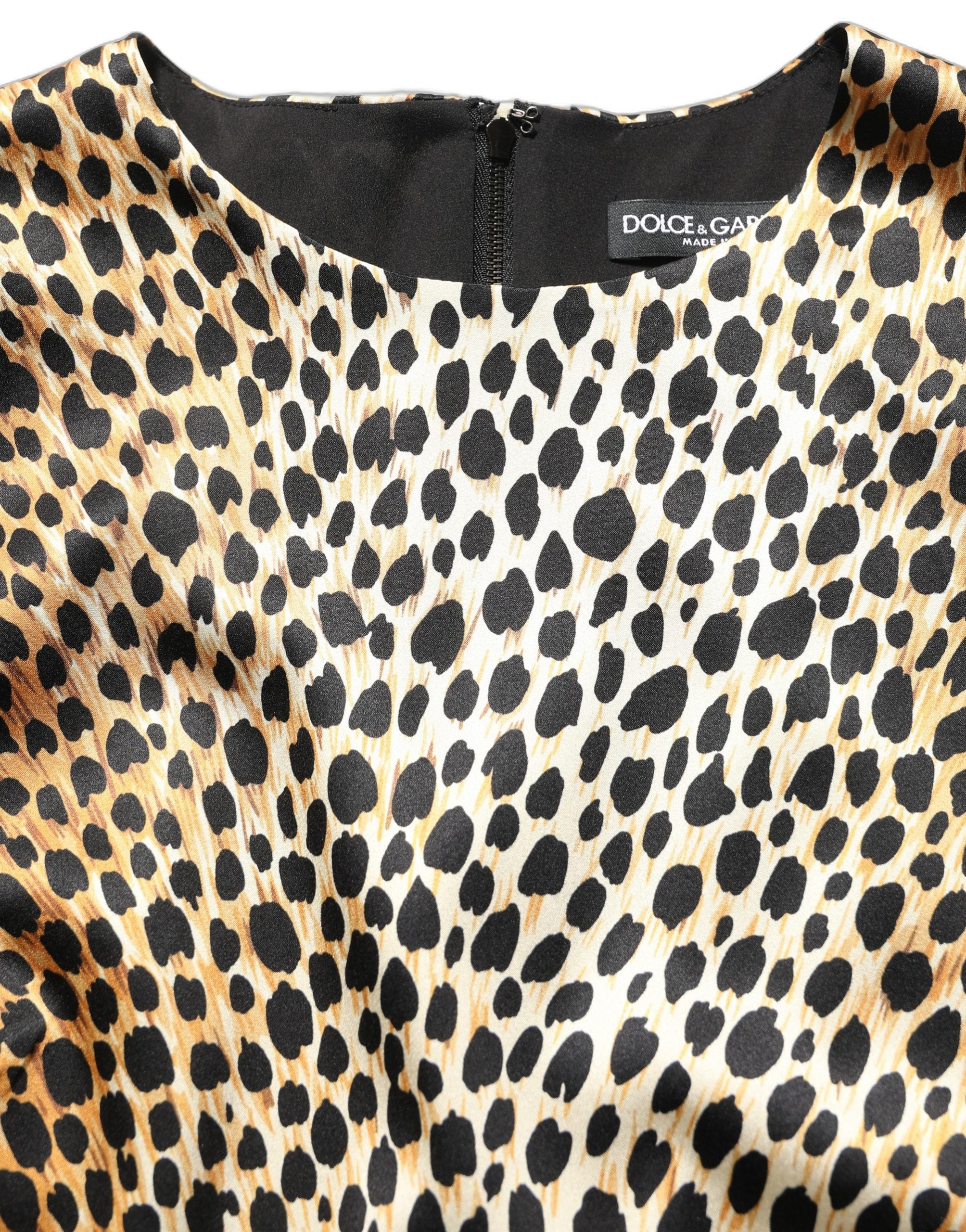 Discover the exquisite Dolce & Gabbana Brown Ocelot Print Long Sleeve Mini Dress, a luxurious blend of silk and elastane, embodying timeless elegance and sophisticated allure.