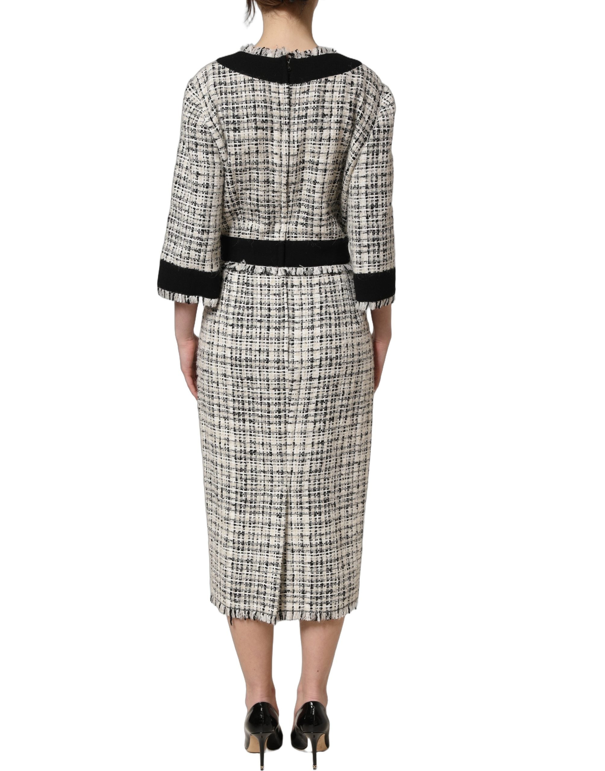 Experience the allure of the Dolce & Gabbana Multicolor Bouclé Tweed Midi Dress, a masterpiece of Italian craftsmanship, blending luxury and timeless elegance for unforgettable moments.