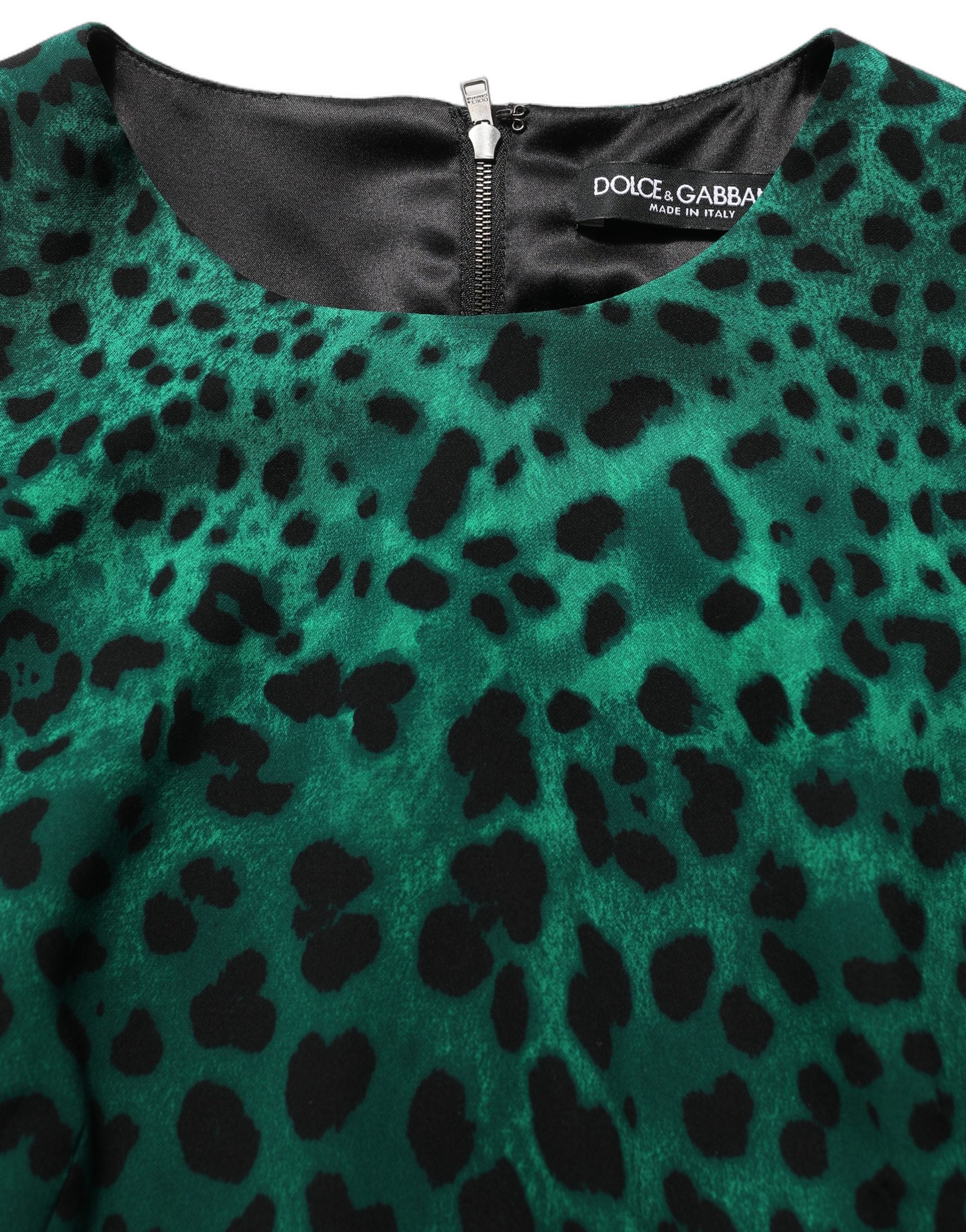 Indulge in the exquisite allure of Dolce & Gabbana's Green Leopard Print Silk Knee Length Dress, a masterpiece of Italian craftsmanship that defines elegance and sophistication.