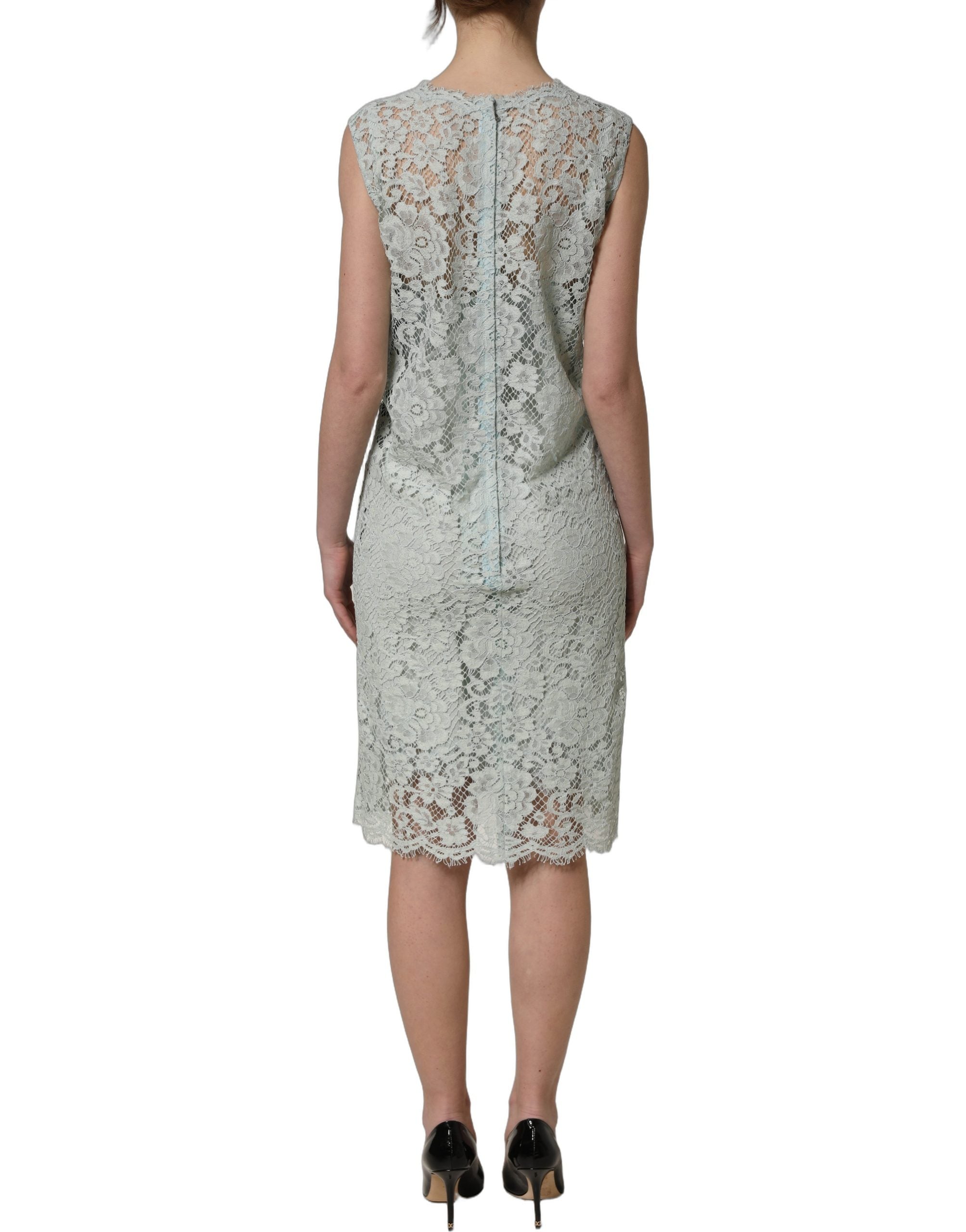Discover the exquisite Dolce & Gabbana Mint Green Lace Sleeveless Dress, a masterpiece of floral lace and silk that embodies timeless elegance for the discerning individual.