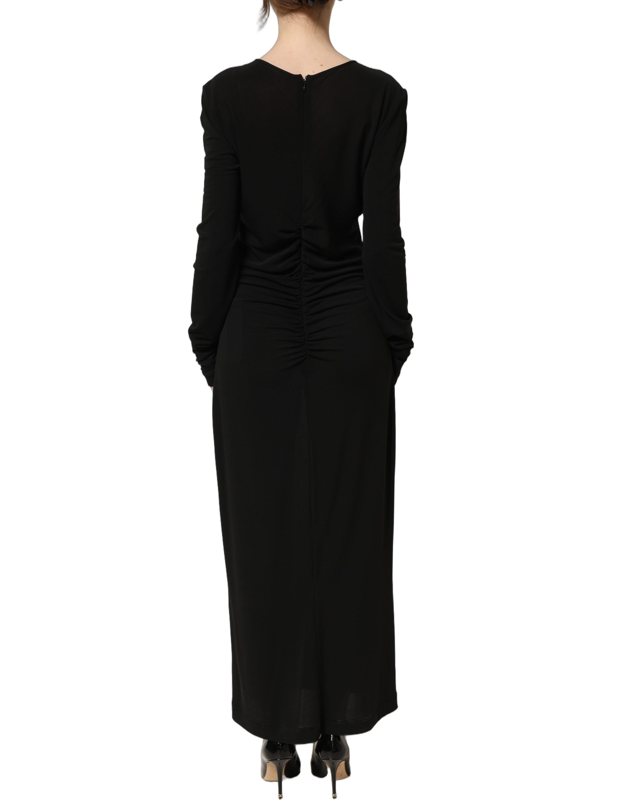 Experience the allure of Dolce & Gabbana's Black Cotton Long Sleeves Sheath Maxi Dress, a masterpiece of Italian craftsmanship that embodies timeless elegance and sophistication.