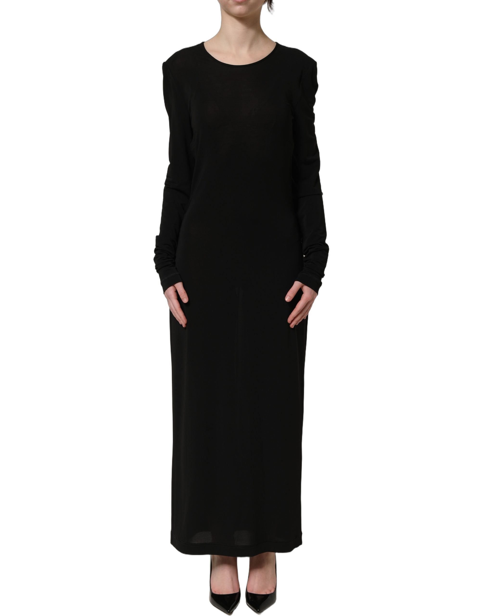 Experience the allure of Dolce & Gabbana's Black Cotton Long Sleeves Sheath Maxi Dress, where exquisite craftsmanship meets timeless elegance for the discerning individual.