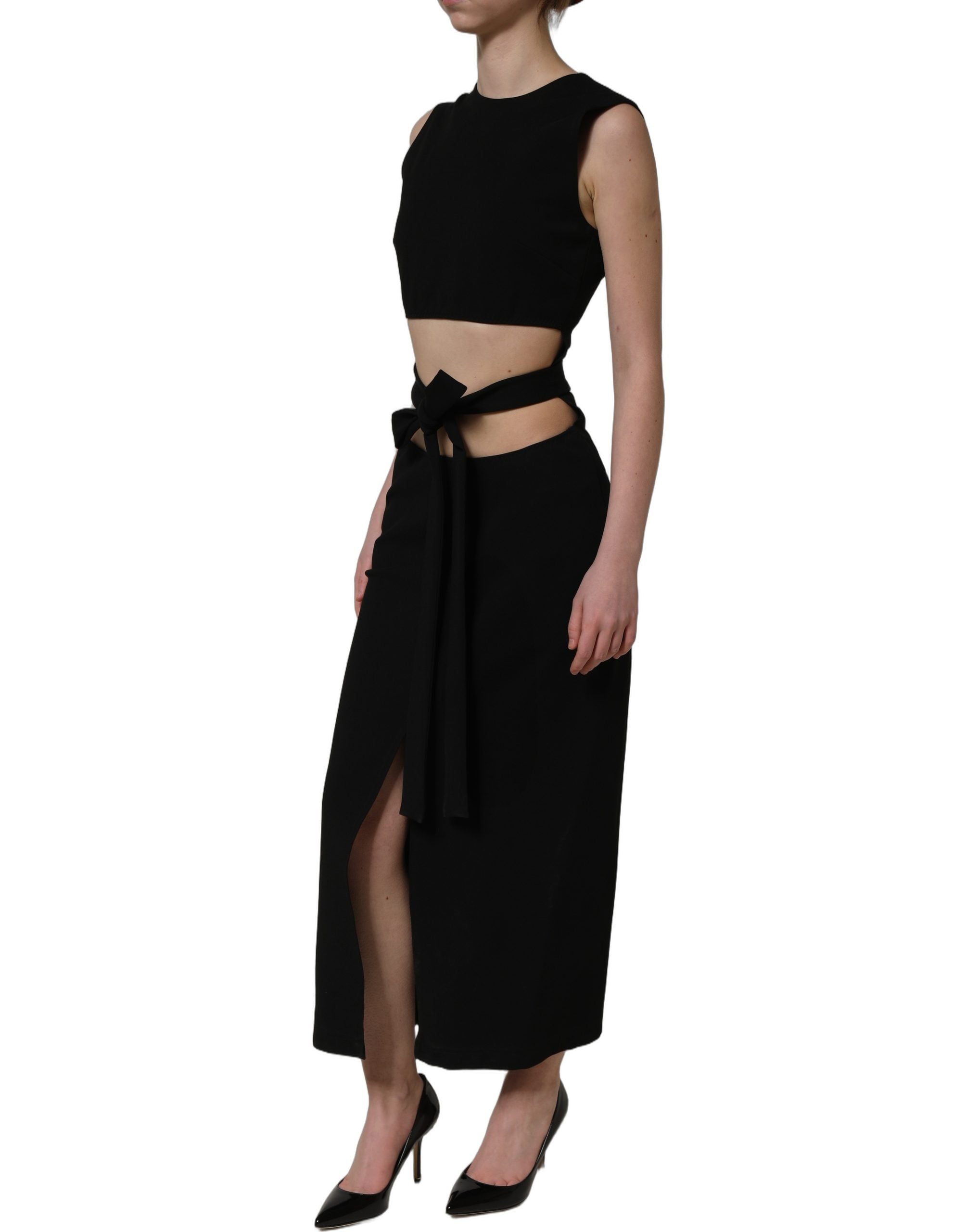 Discover the allure of Dolce & Gabbana's Black Cut Out Detail Sleeveless Maxi Dress, a masterpiece of luxurious craftsmanship and timeless elegance, perfect for any sophisticated occasion.