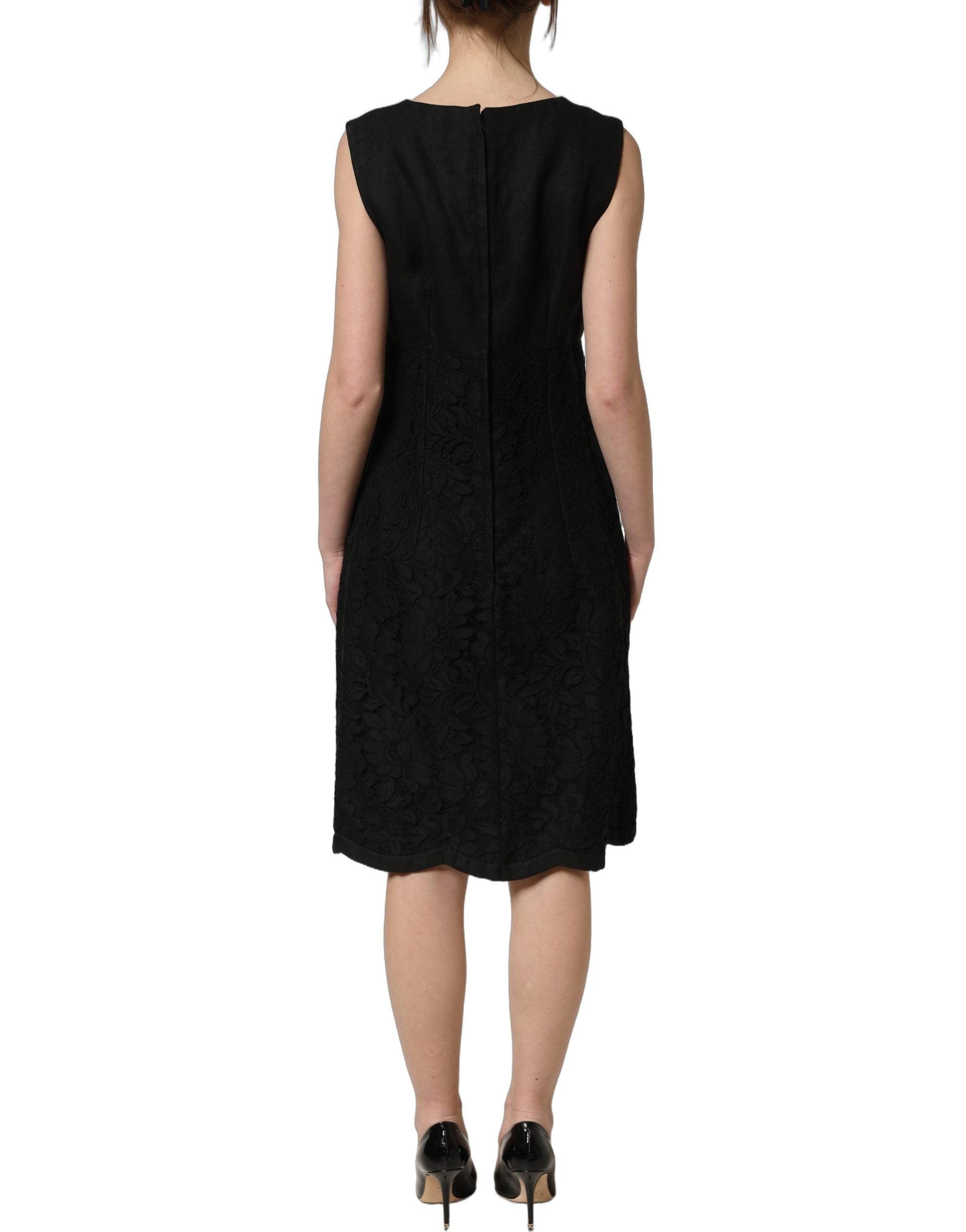 Experience the exquisite allure of the Dolce & Gabbana Black Floral Lace Sleeveless Shift Dress, a masterpiece of Italian craftsmanship that embodies timeless elegance and sophistication.