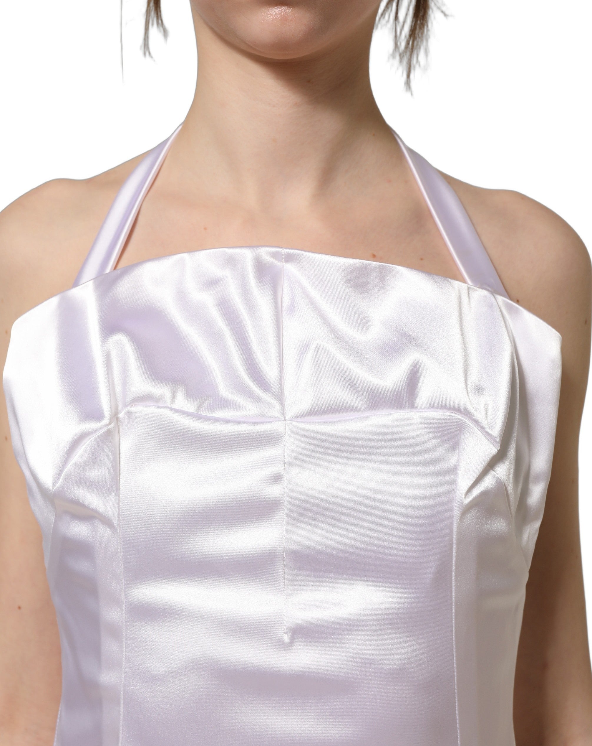 Experience the allure of the Dolce & Gabbana White Satin Halter Backless Long Gown, a masterpiece of Italian craftsmanship that redefines luxury and elegance.