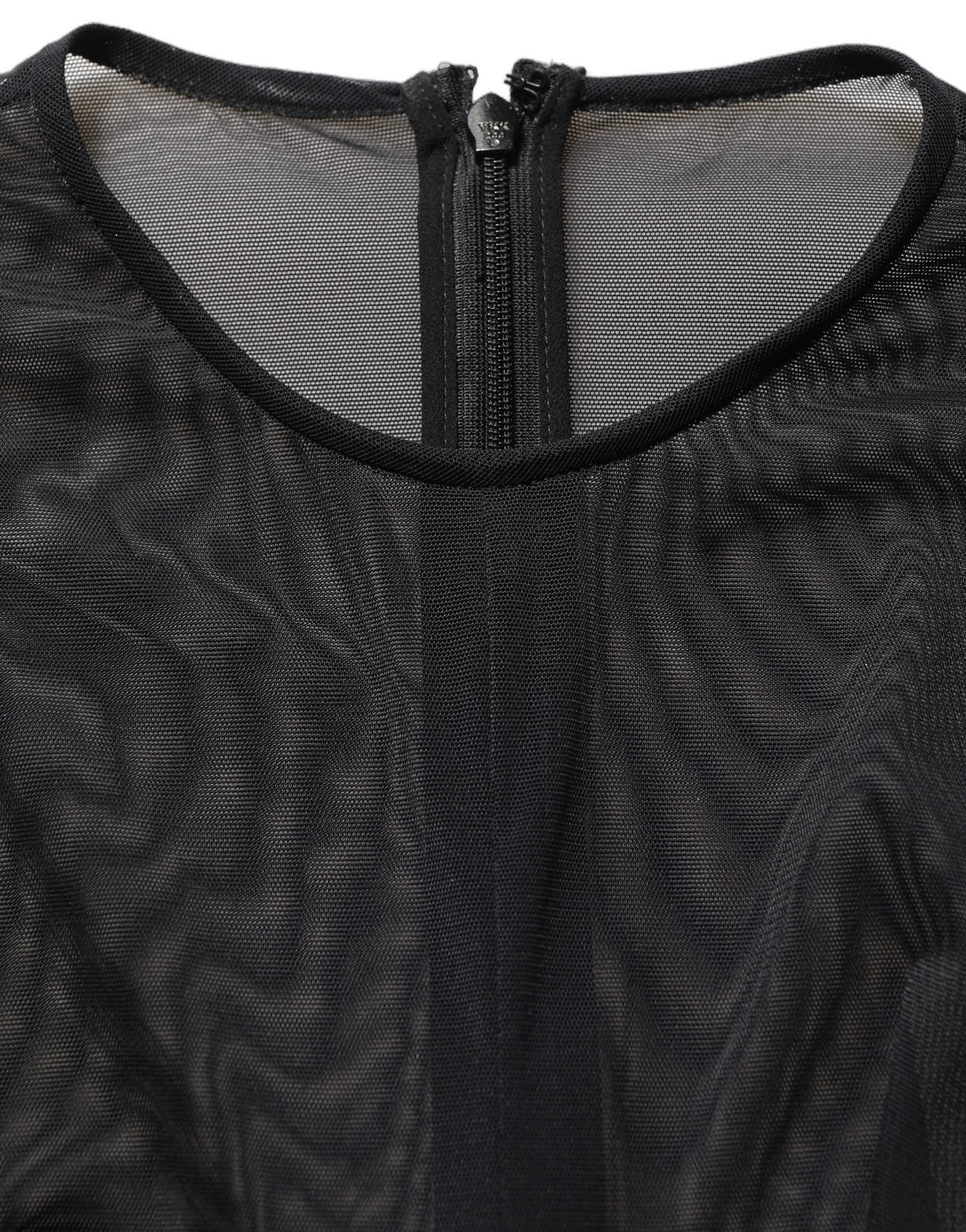 Experience the allure of the Dolce & Gabbana Black Long Sleeve Sheer Fitted Maxi Dress, a masterpiece of Italian craftsmanship that embodies timeless elegance and sophistication.