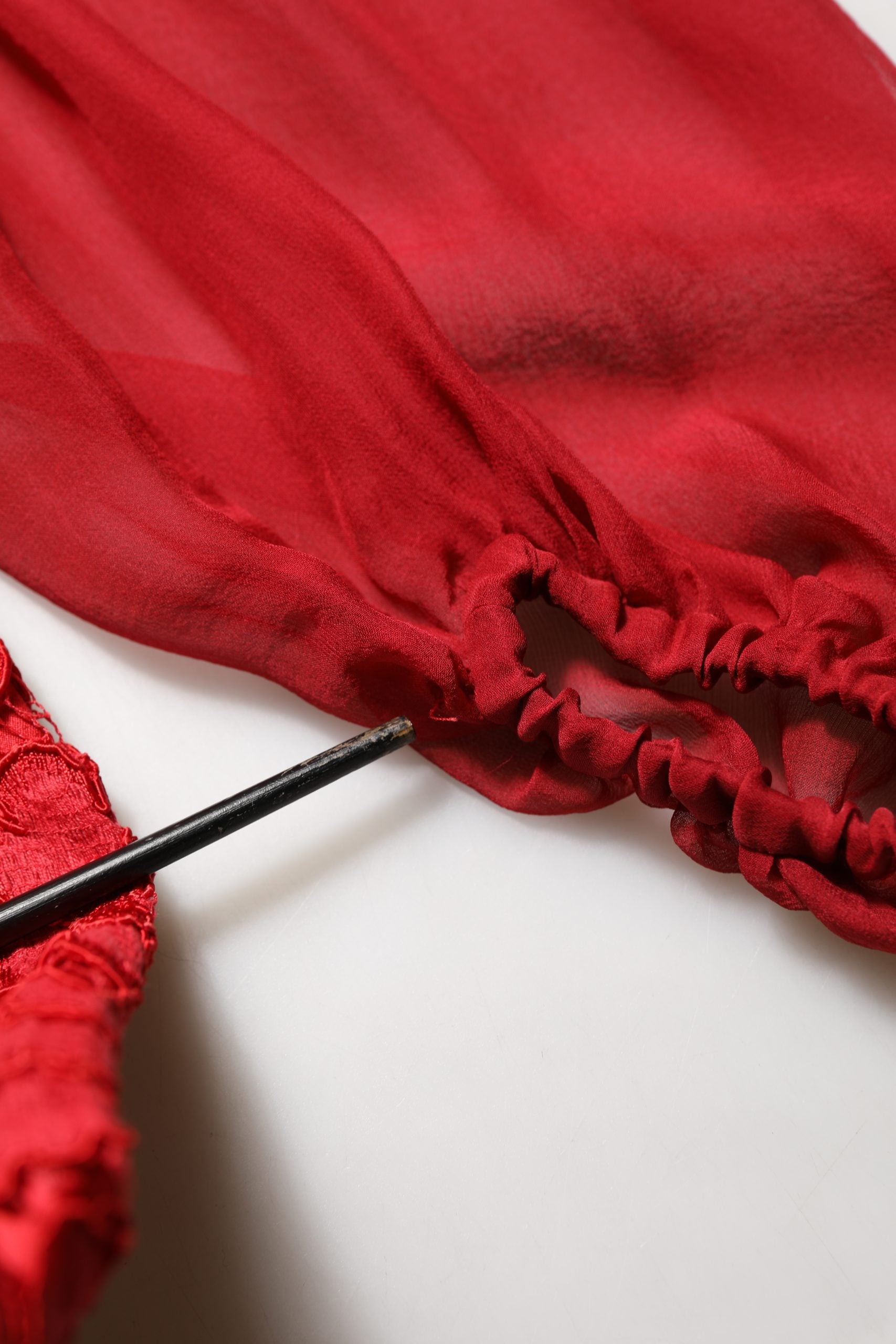 Experience the allure of the Dolce & Gabbana Red Embellished Mermaid Long Gown, a testament to Italian craftsmanship that redefines elegance for any occasion.