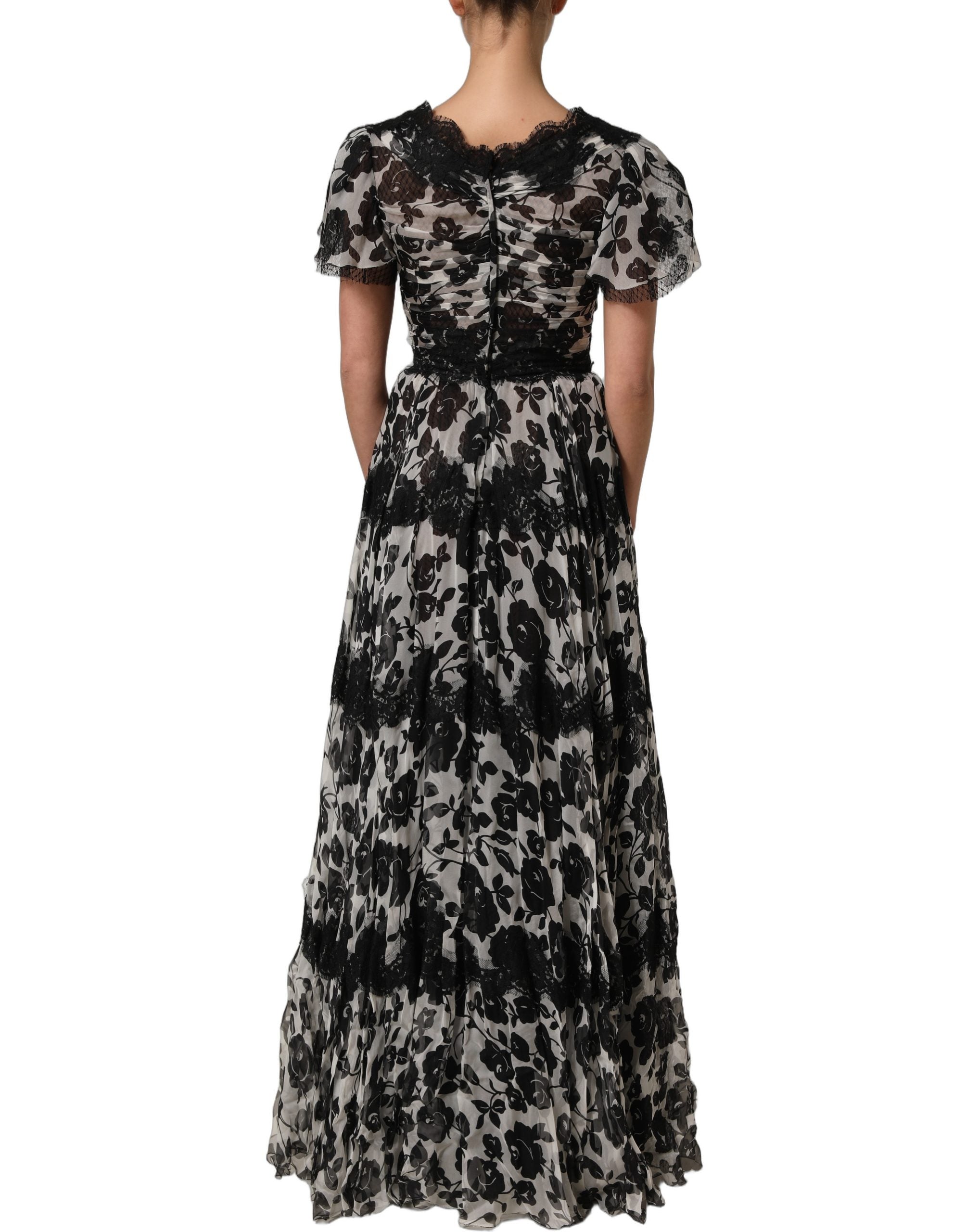 Indulge in the exquisite Dolce & Gabbana Black Silk Floral Lace Ricamo Ball Maxi Dress, where luxurious silk meets intricate lace, embodying timeless elegance and sophistication.