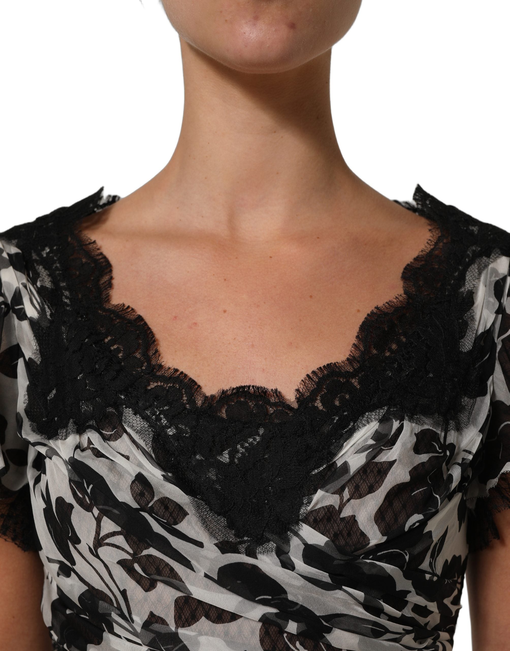 Indulge in the exquisite Dolce & Gabbana Black Silk Floral Lace Ricamo Ball Maxi Dress, a timeless piece that embodies luxury and sophistication, perfect for any elegant occasion.