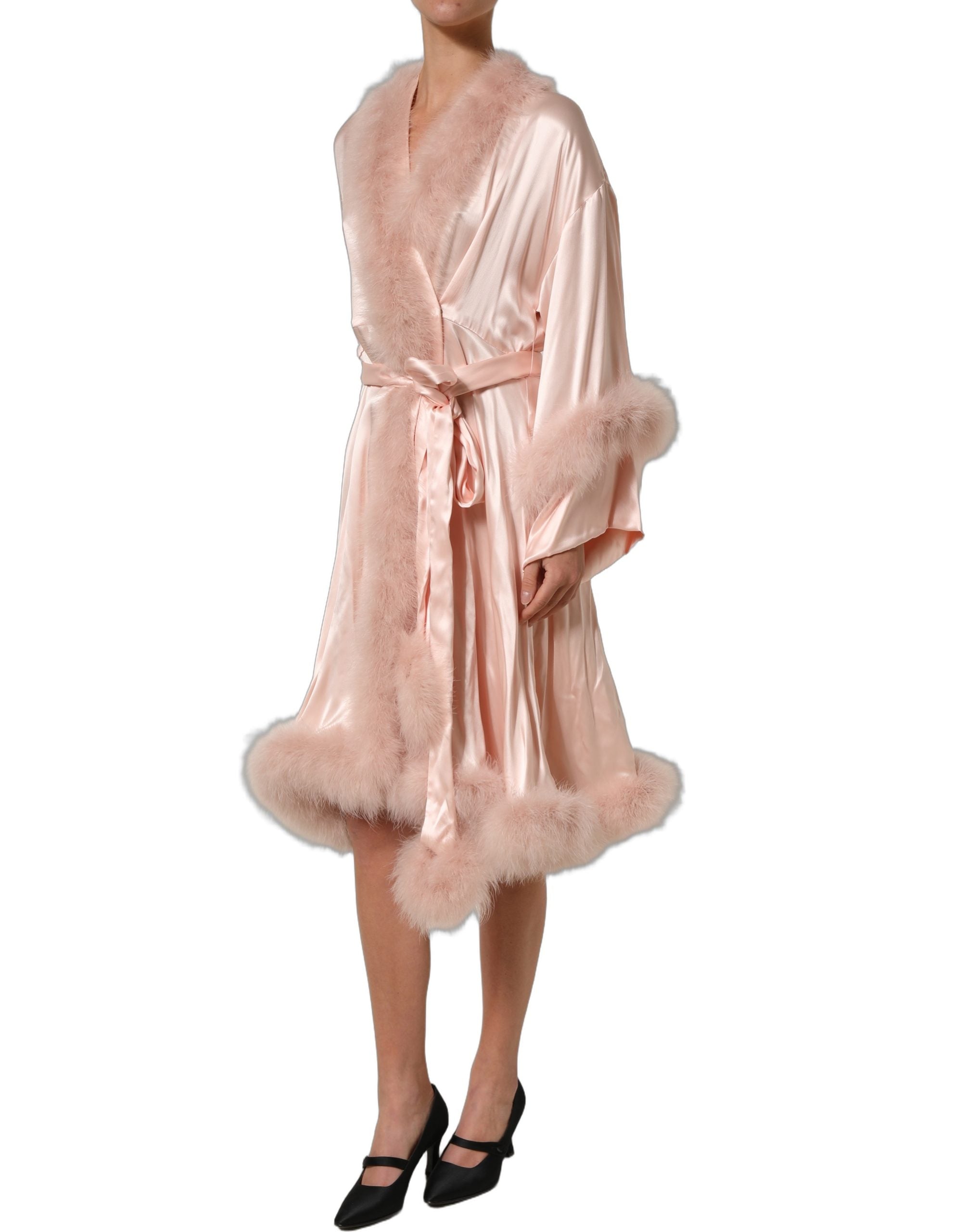 Experience the allure of the Dolce & Gabbana Light Pink Silk Turkey Feather Wrap Midi Dress, where exquisite craftsmanship meets luxurious silk for an unforgettable statement.