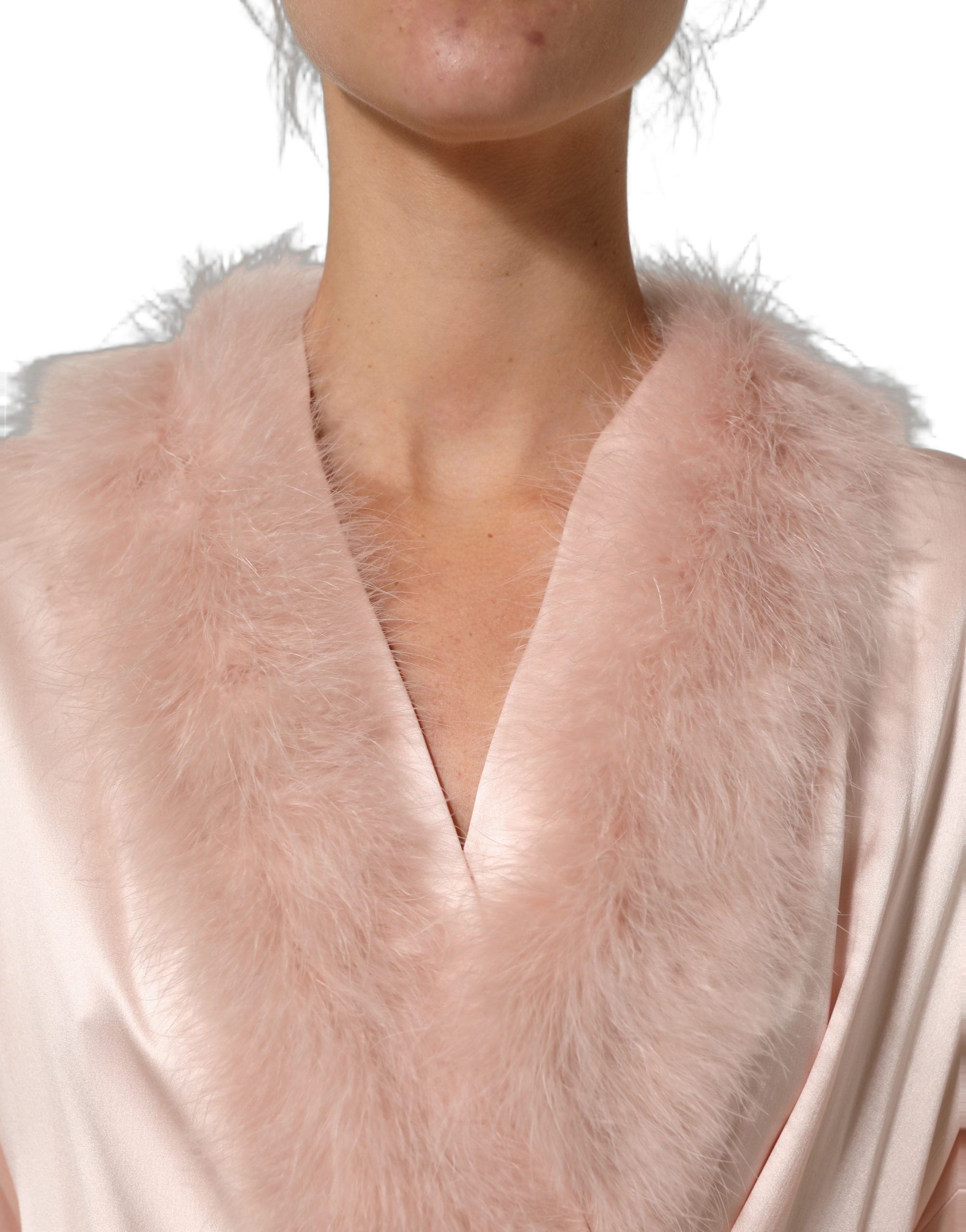 Experience the exquisite allure of the Dolce & Gabbana Light Pink Silk Turkey Feather Wrap Midi Dress, where luxurious silk and meticulous craftsmanship redefine elegance.