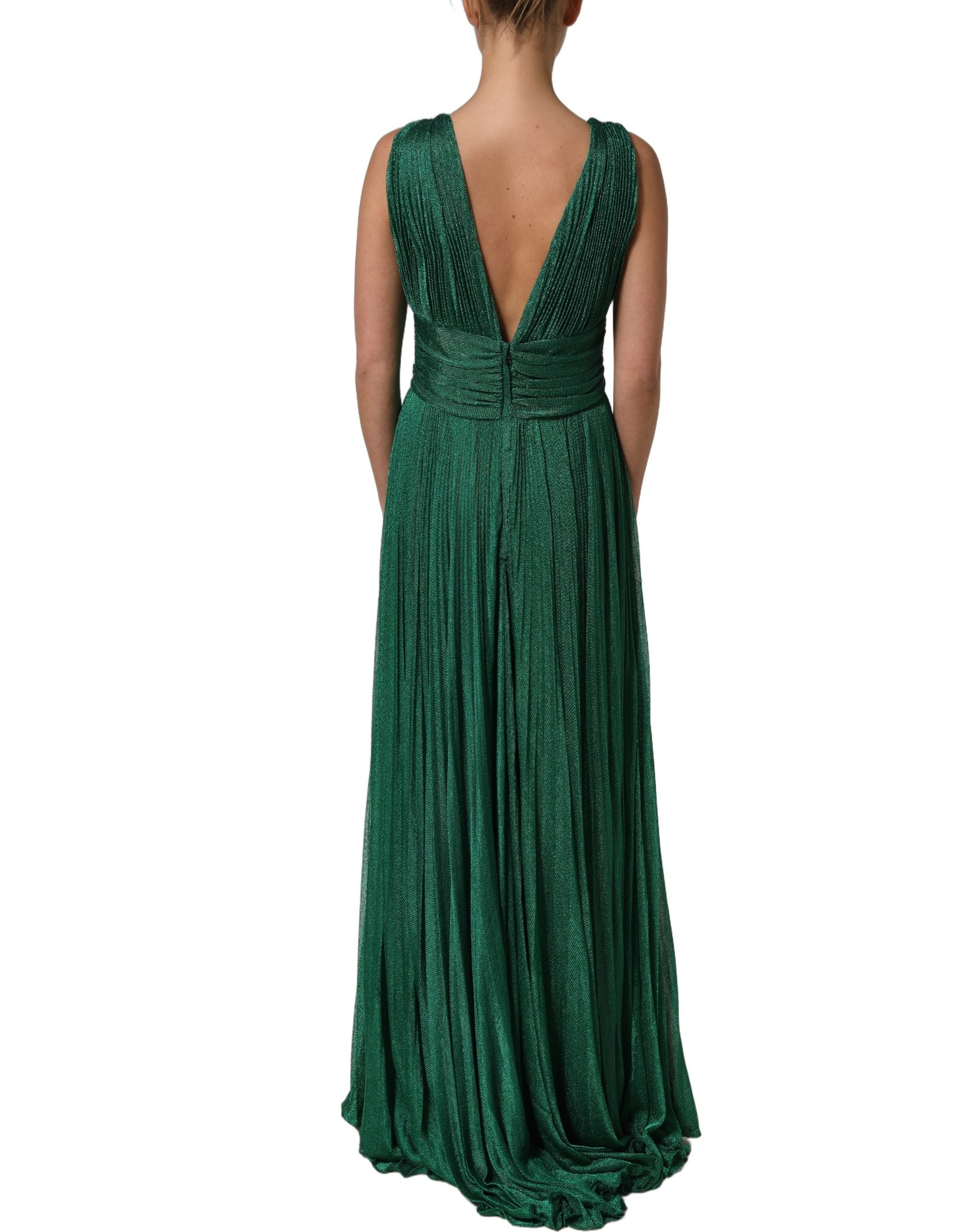 Indulge in the allure of the Dolce & Gabbana Emerald Green Plissé Evening Gown, where exquisite craftsmanship meets luxurious design for unforgettable elegance.
