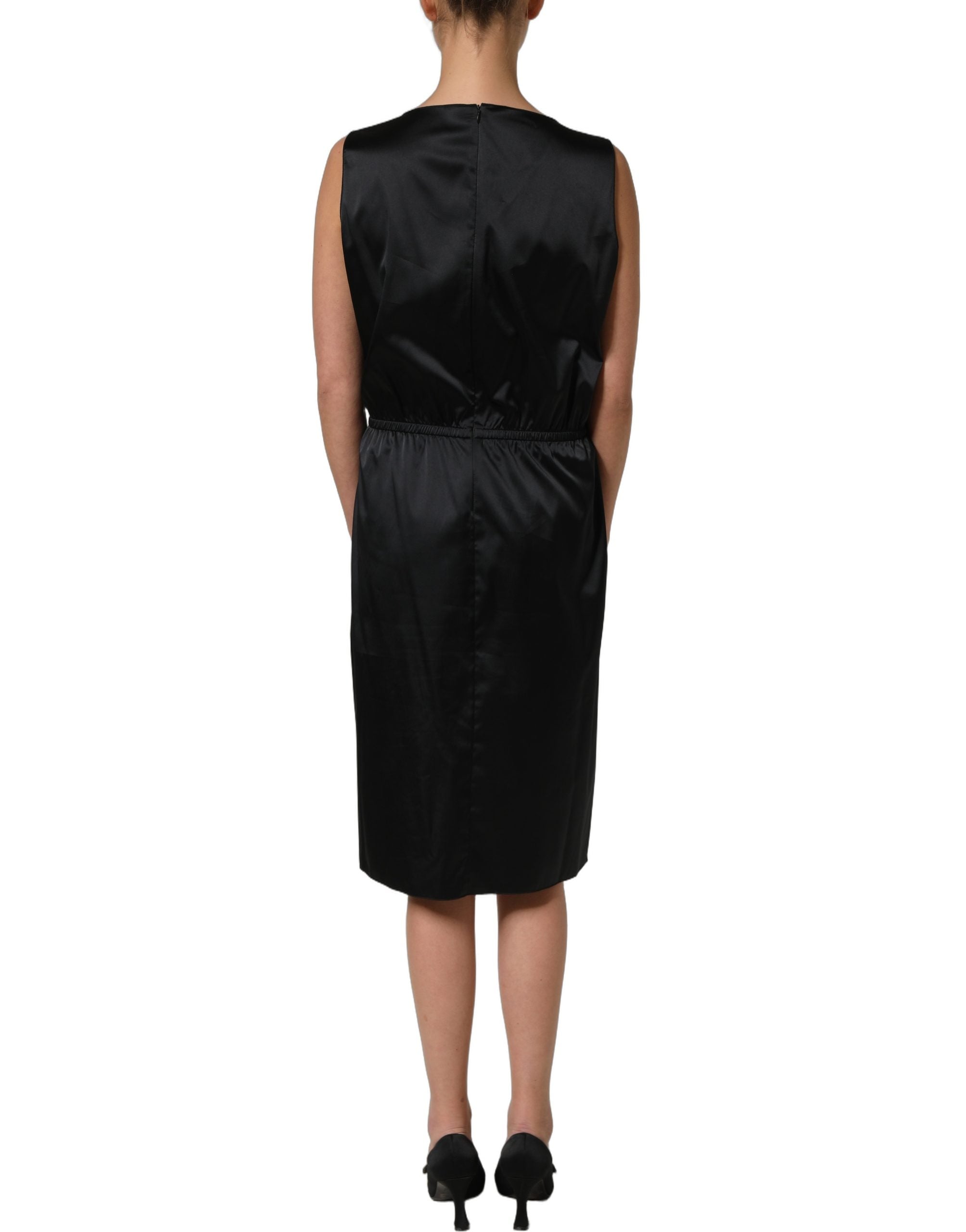 Elevate your wardrobe with the Dolce & Gabbana Black Lace Trim Midi Dress, a masterpiece of Italian craftsmanship that embodies timeless elegance and sophistication.