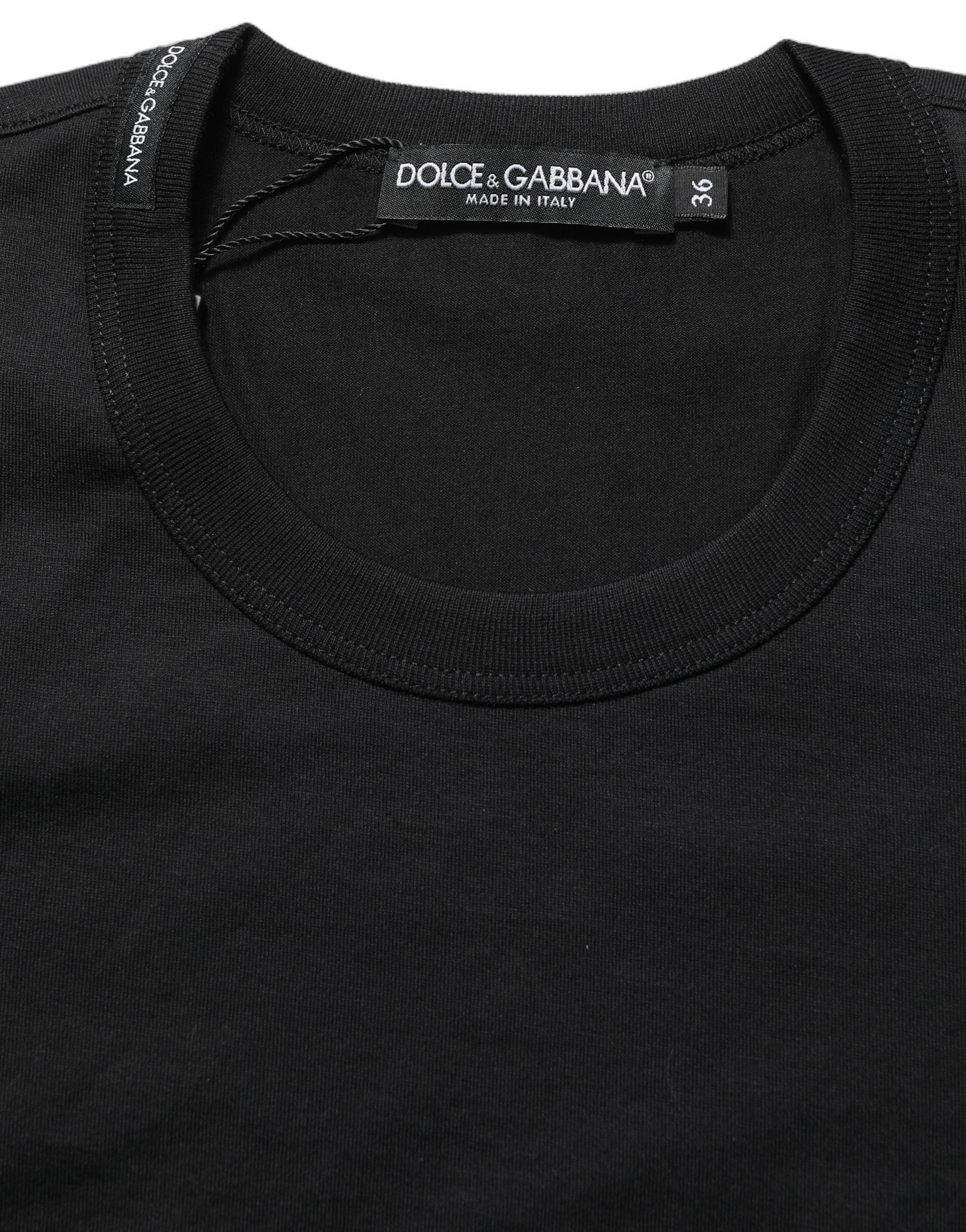 Experience the exquisite allure of Dolce & Gabbana's Black Cotton Crew Neck T-shirt, a testament to Italian craftsmanship and timeless elegance for the discerning individual.