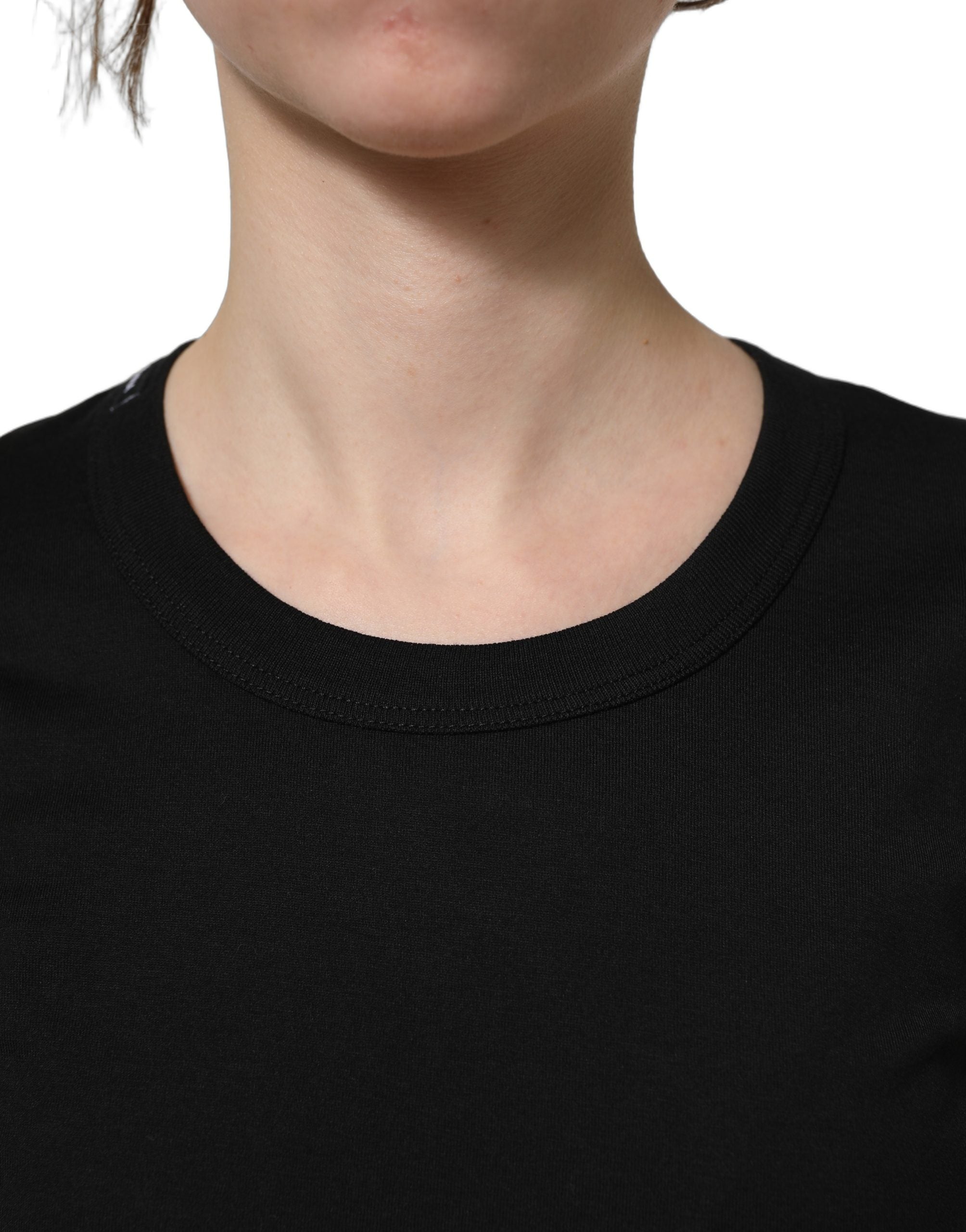 Elevate your wardrobe with the Dolce & Gabbana Black Cotton Crew Neck T-shirt, a masterpiece of Italian craftsmanship that embodies timeless luxury and effortless elegance.
