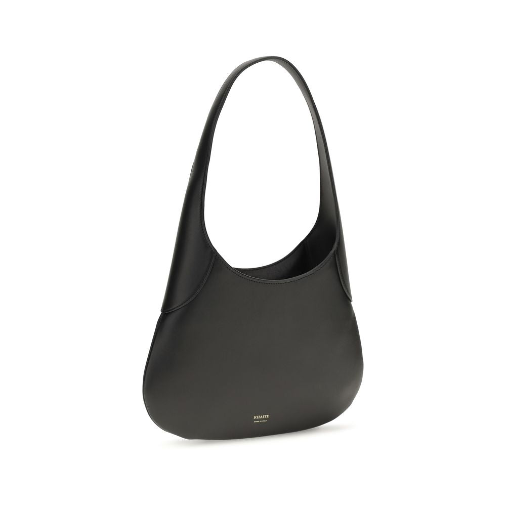 Discover the Khaite Black Calf Leather Bos Taurus Handbag, an artisanal masterpiece that embodies elegance and sophistication for the discerning individual.