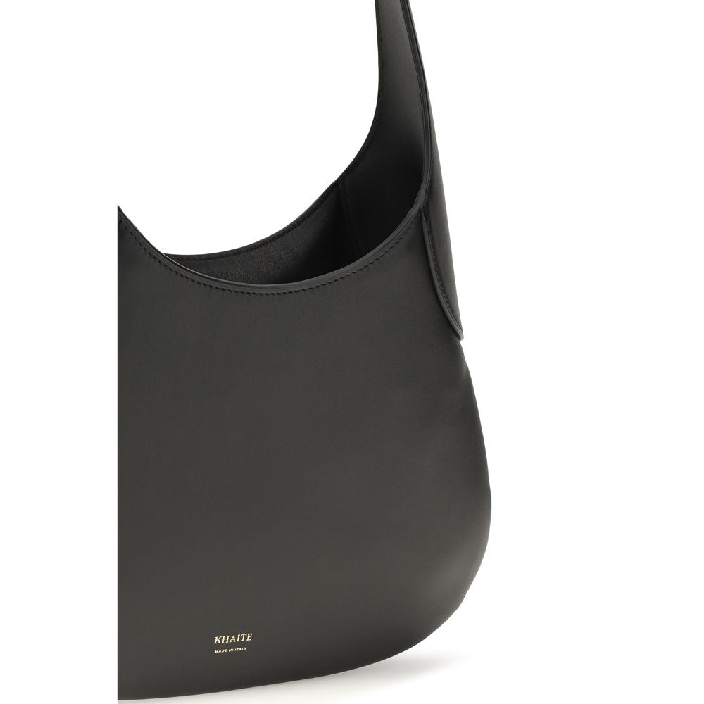 Discover the Khaite Black Calf Leather Bos Taurus Handbag, an artisanal masterpiece of elegance and sophistication, perfect for the discerning individual.