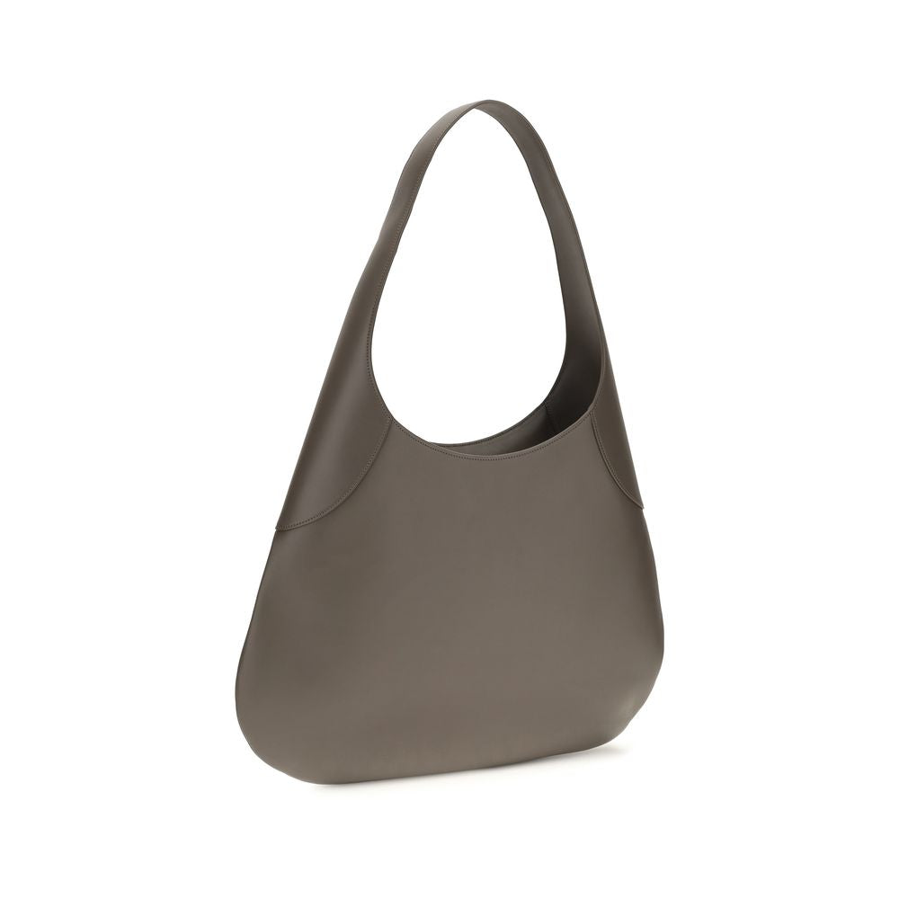 Elevate your style with the Khaite Gray Calf Leather Bos Taurus Handbag, a masterpiece of artisanal craftsmanship that embodies sophistication and timeless elegance.