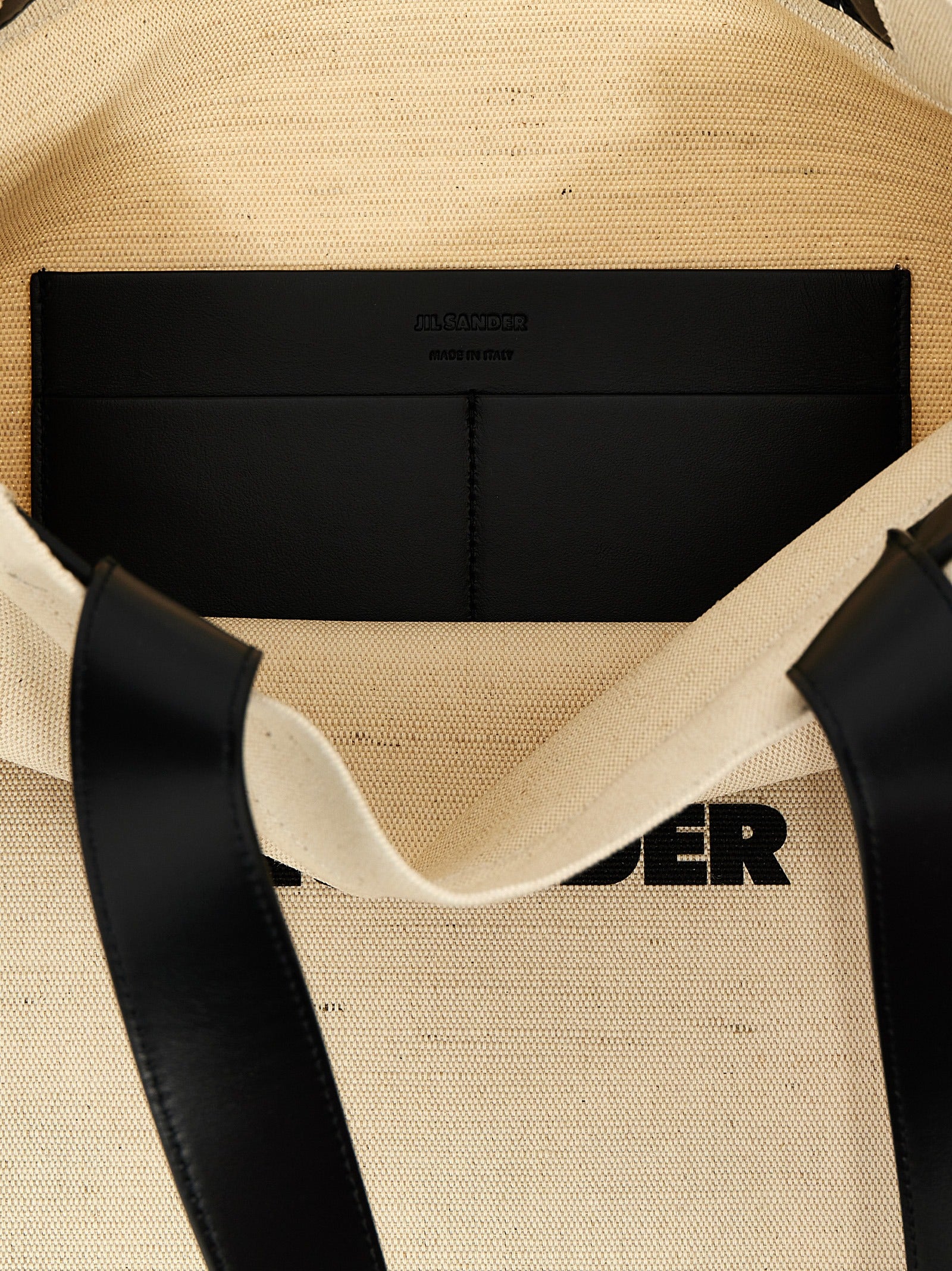 Elevate your style with the Jil Sander Bicolor Jute Tote Bag, an exquisite blend of jute and cotton, embodying timeless elegance and artisanal luxury for discerning individuals.