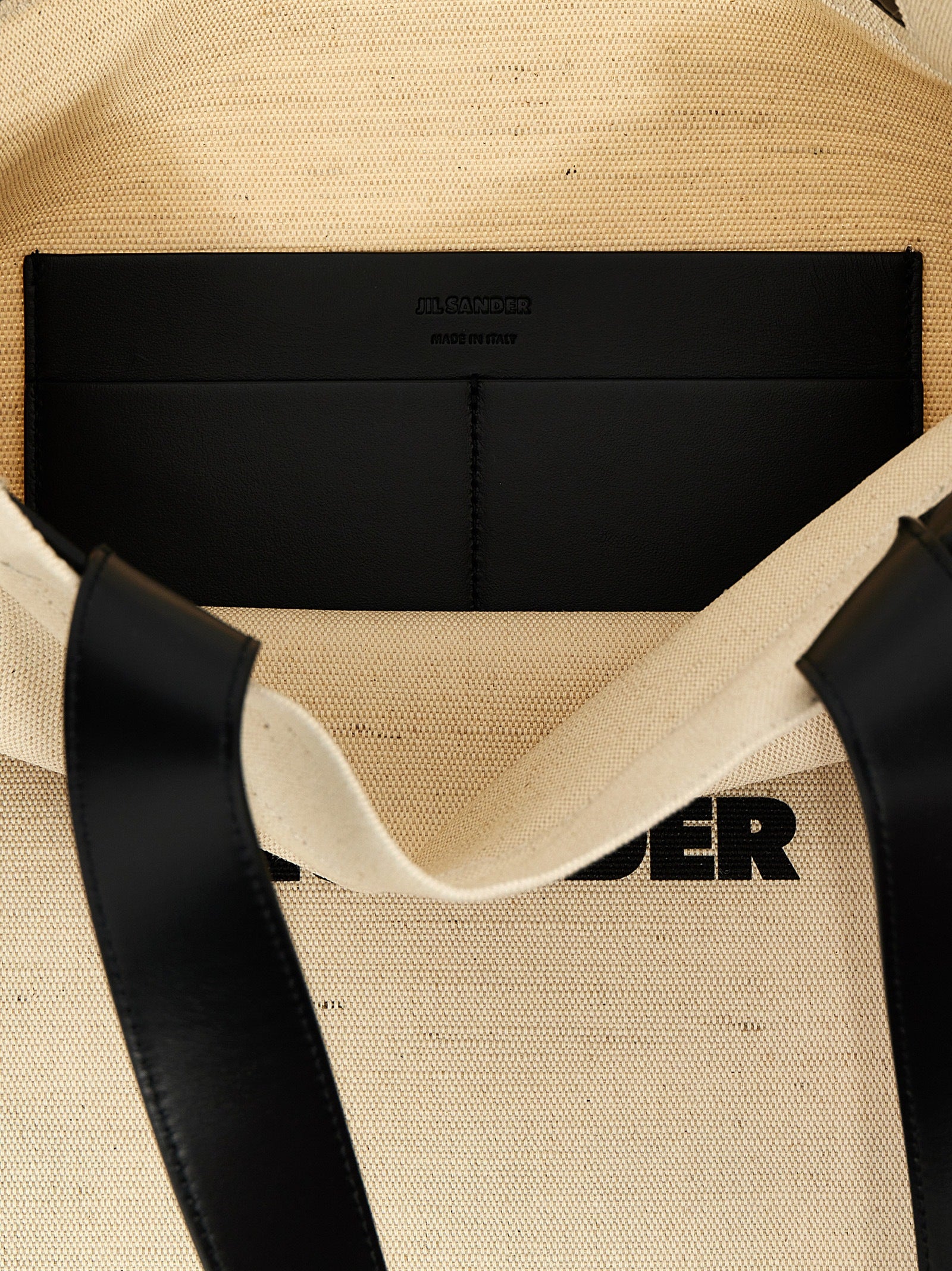 Discover the Jil Sander Bicolor Cotton Tote Bag, a masterpiece of artisanal elegance, blending luxurious materials and sophisticated design for the discerning individual.