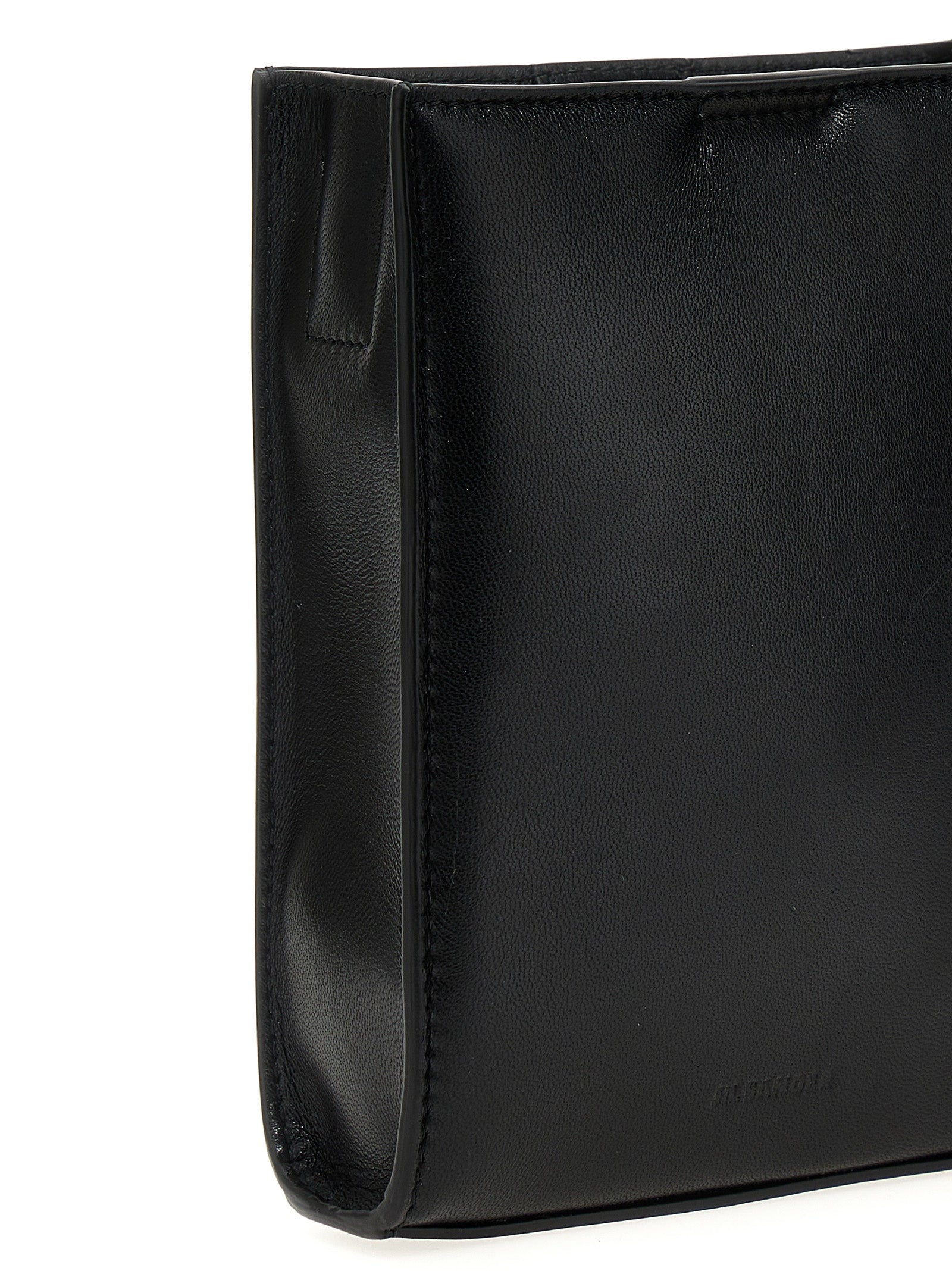 Experience the allure of the Jil Sander Black Calfskin Crossbody Bag, a masterpiece of Italian craftsmanship that embodies timeless elegance and modern sophistication.