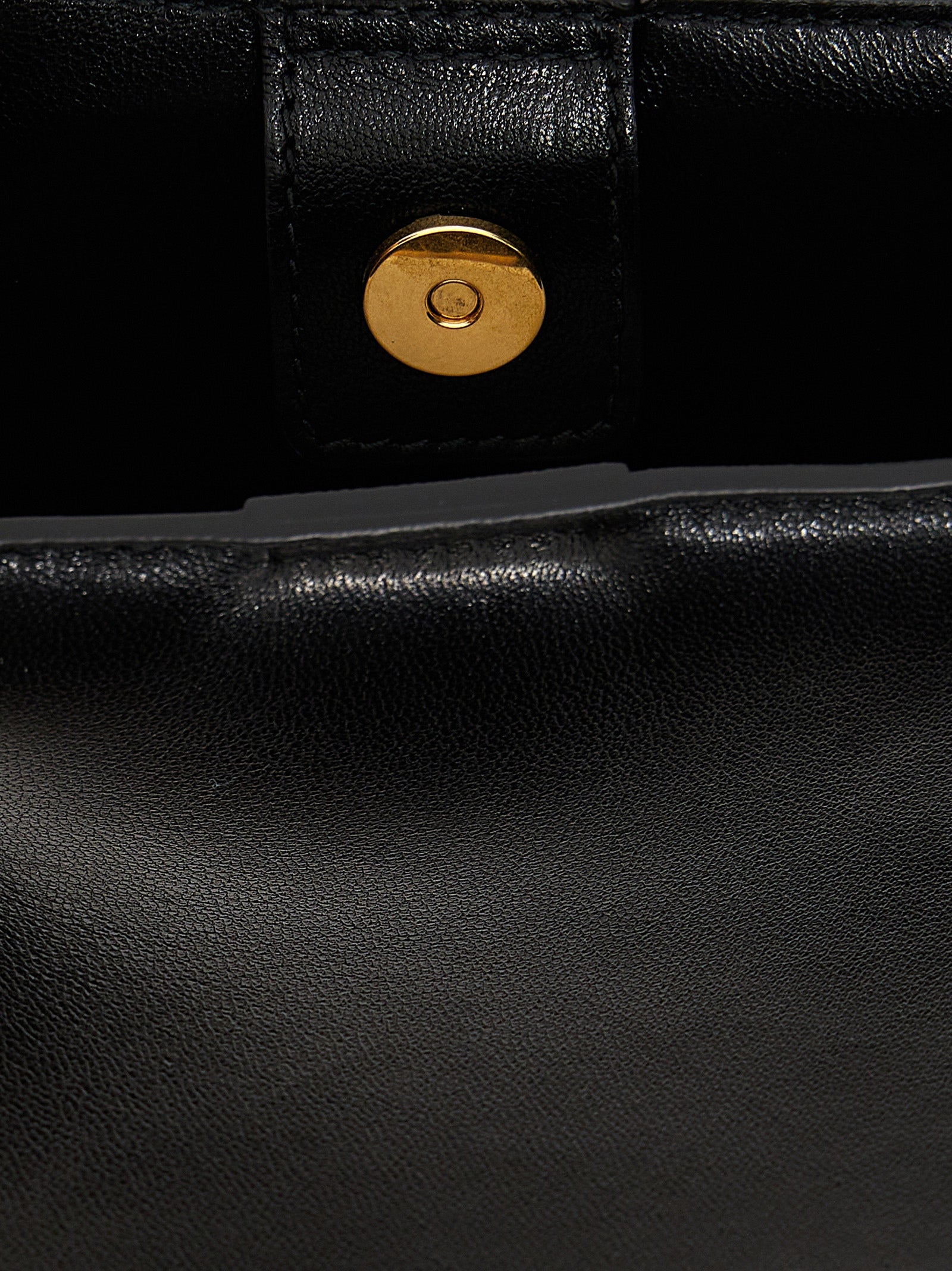 Elevate your style with the Jil Sander Black Calfskin Crossbody Bag, a masterpiece of Italian craftsmanship, blending timeless elegance with modern sophistication.