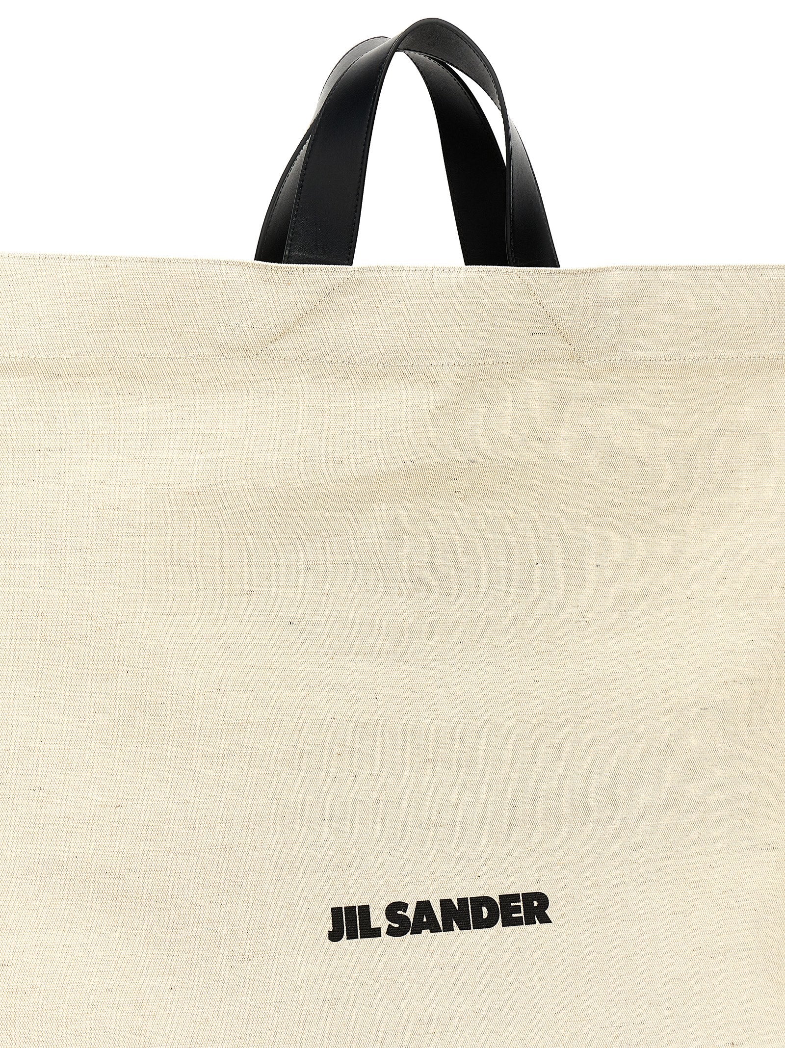 Elevate your style with the Jil Sander Bicolor Jute Tote Bag, a luxurious blend of jute and cotton, embodying timeless elegance and artisanal craftsmanship.