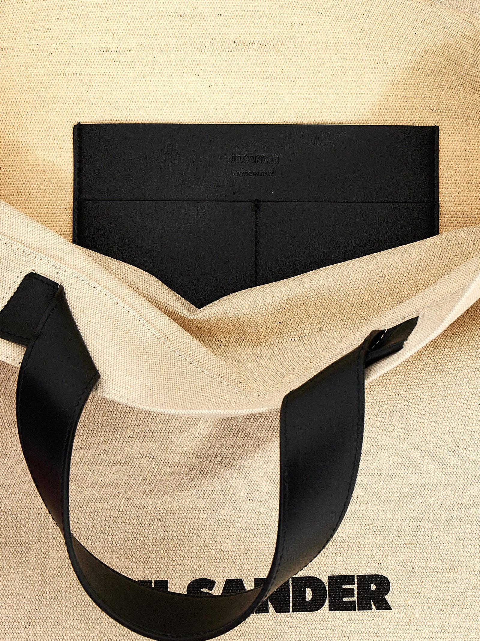 Discover the Jil Sander Bicolor Jute Tote Bag, a harmonious blend of jute and cotton, embodying timeless elegance and artisanal luxury for the discerning individual.