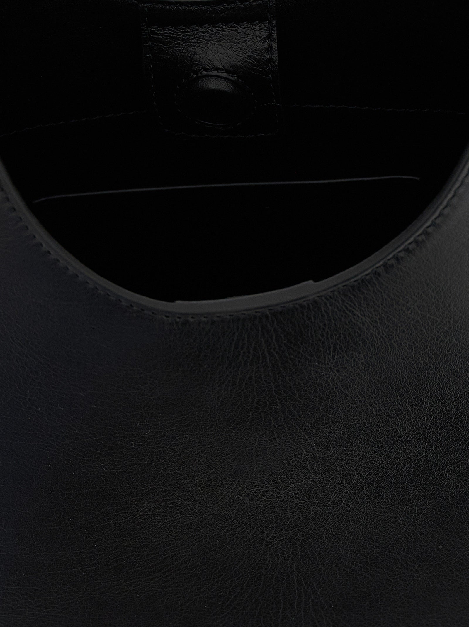 Discover the Jil Sander Black Bovine Leather Shoulder Bag, a fusion of exquisite craftsmanship and contemporary elegance, perfect for the discerning individual.