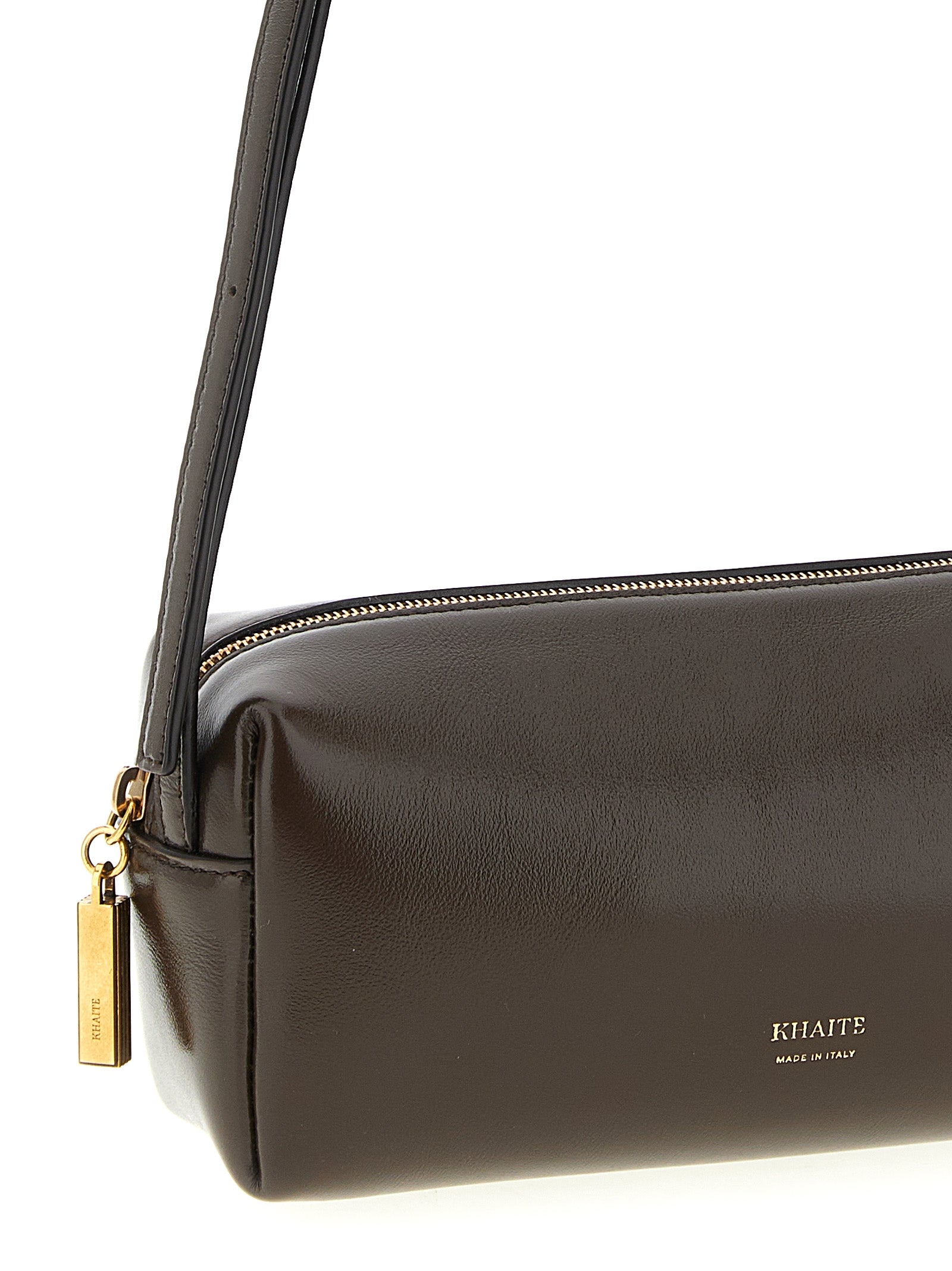 Discover the KHAITE Brown Calfskin Crossbody Bag, a symbol of artisanal luxury crafted in Italy, elevating your style with timeless elegance and sophistication.