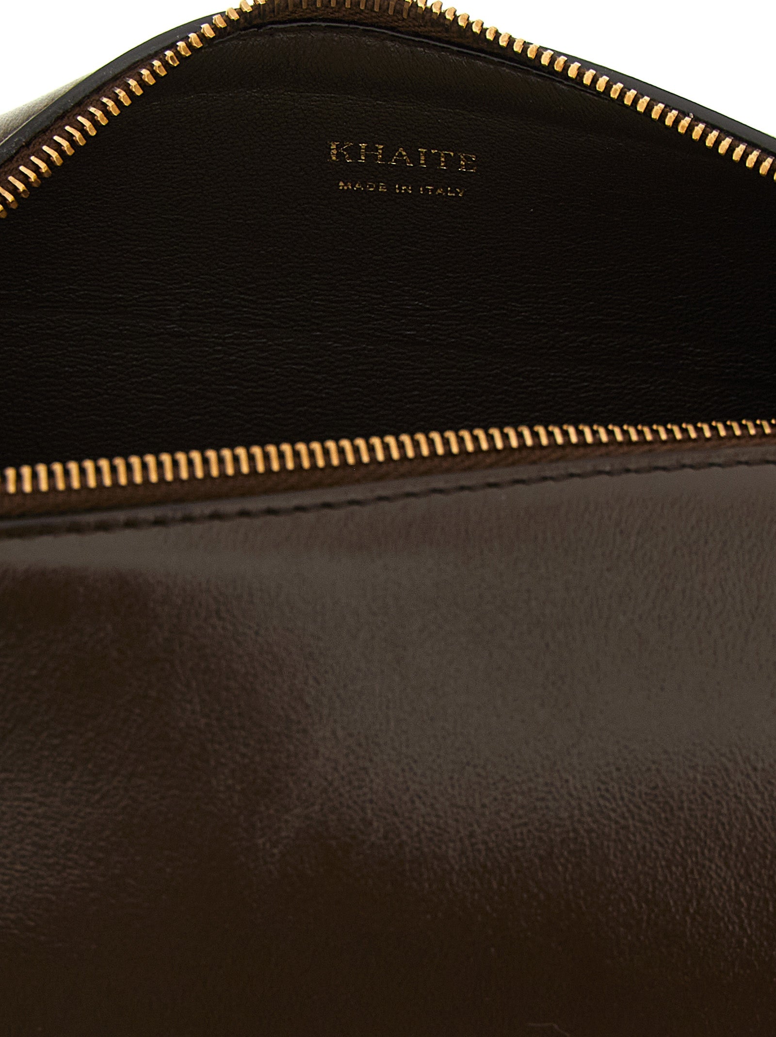 Discover the KHAITE Brown Calfskin Crossbody Bag, a masterpiece of artisanal luxury crafted from exquisite calfskin leather, perfect for elevating any ensemble.