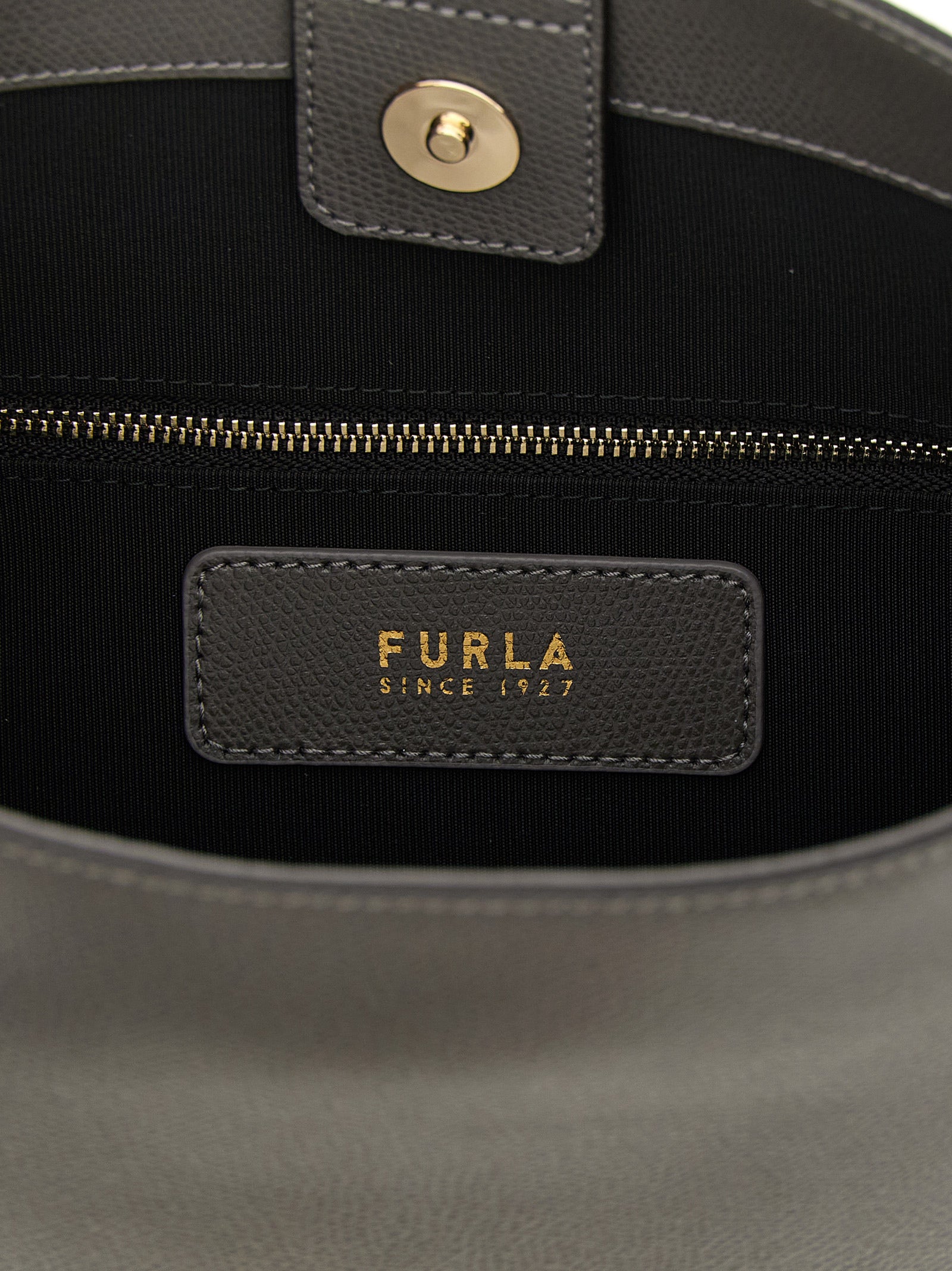 Discover the Furla Gray Calfskin Shoulder Bag, a luxurious blend of elegance and functionality crafted from premium leather, perfect for the discerning individual.
