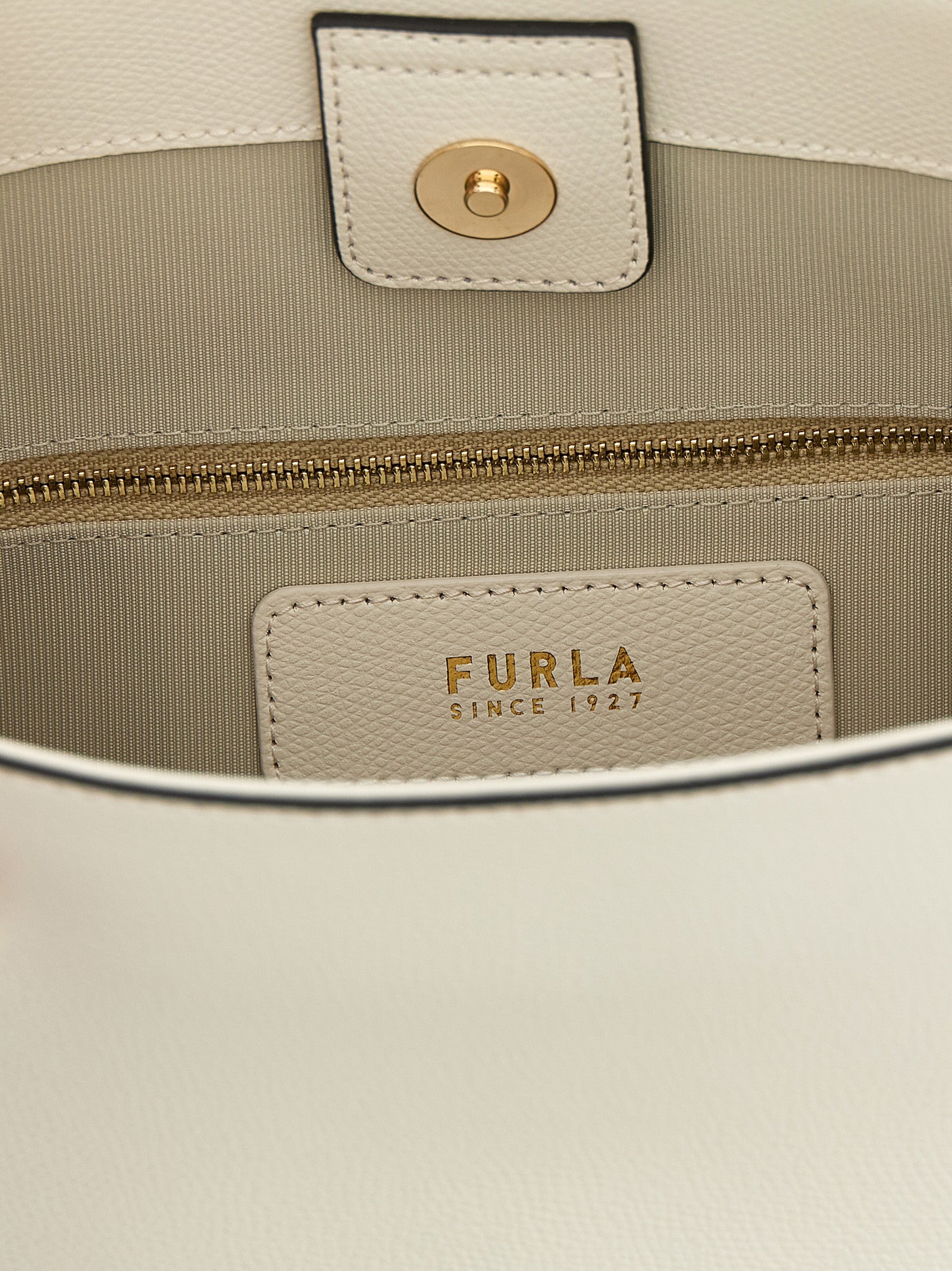 Experience the allure of the Furla Small 'Roxie' bucket bag, crafted from exquisite calfskin leather, embodying timeless elegance and versatile luxury for every occasion.