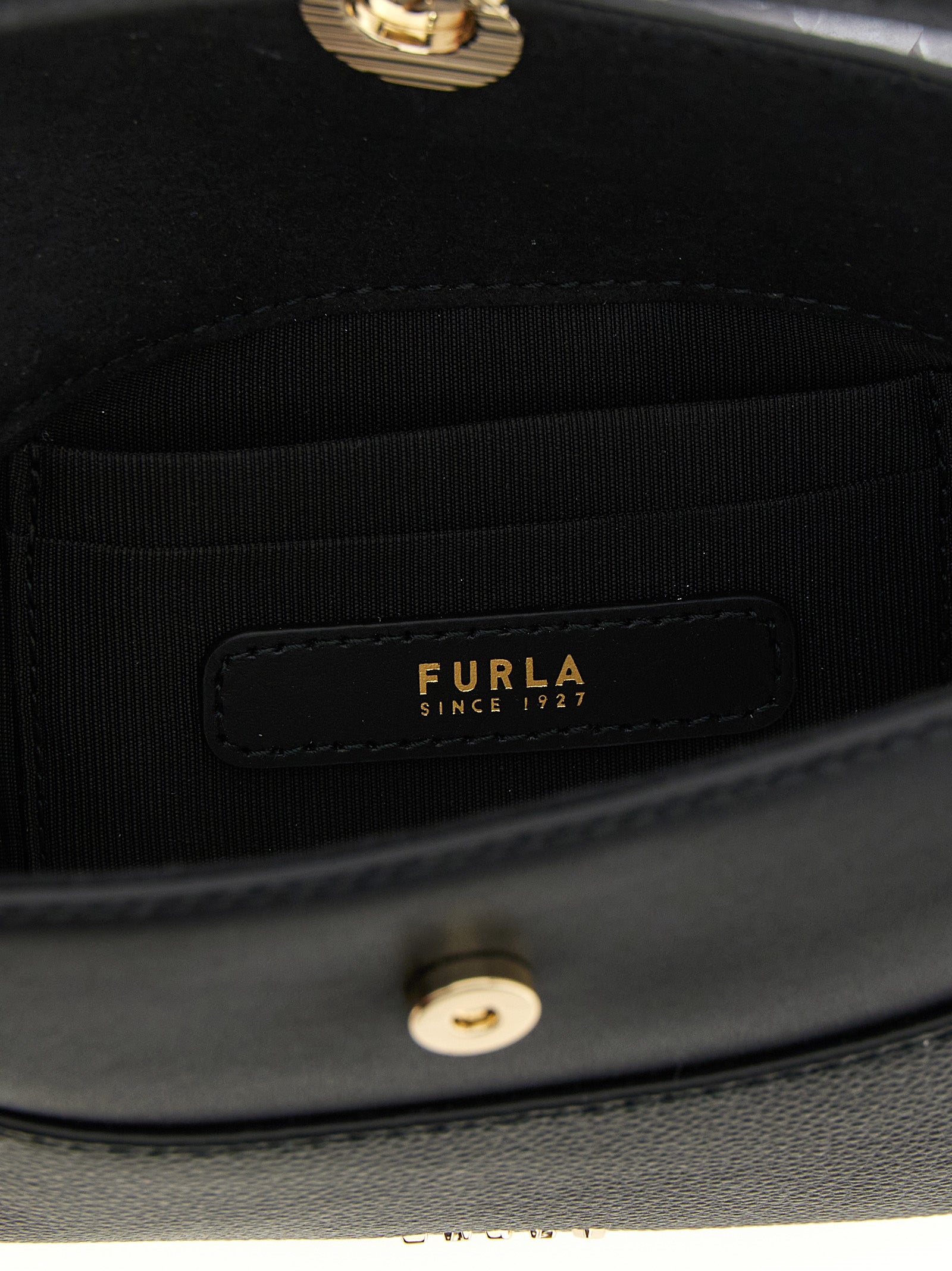 Indulge in the exquisite Furla Black Calfskin Handbag, a masterpiece of artisanal luxury, crafted from premium leather for those who embody elegance and sophistication.