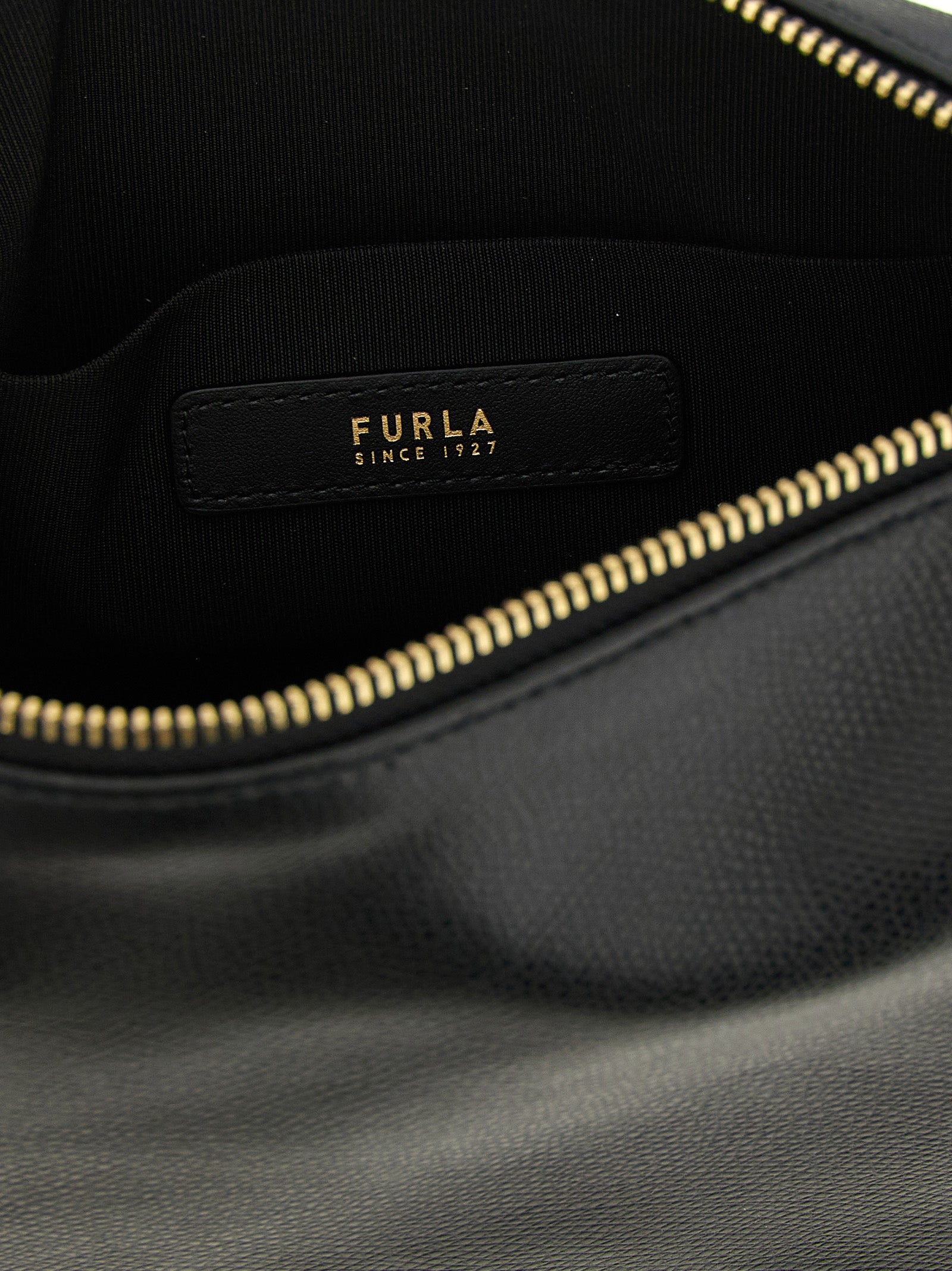 Discover the Furla Black Calfskin Shoulder Bag, a masterpiece of exquisite craftsmanship and timeless elegance, perfect for elevating your style with luxurious versatility.